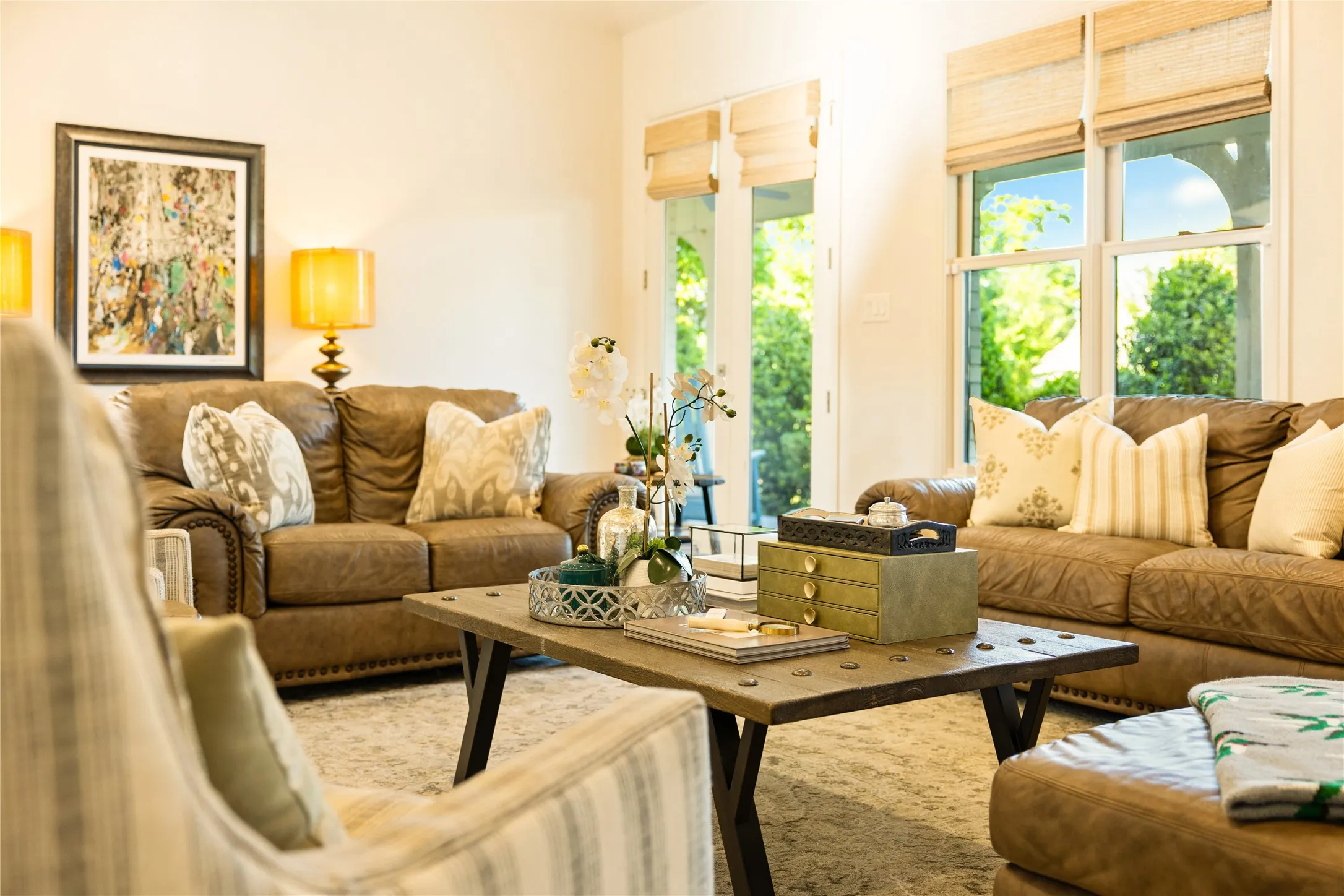 Light filled living spaces feature warm wood accents, custom built ins, and an open concept design that blends comfort and elegance throughout the home.