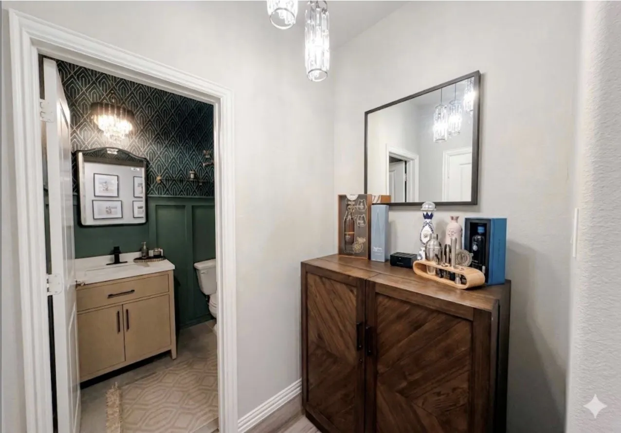 Powder room featuring board and batten wall paneling, patterned wallpaper, and a gold-tone chandelier