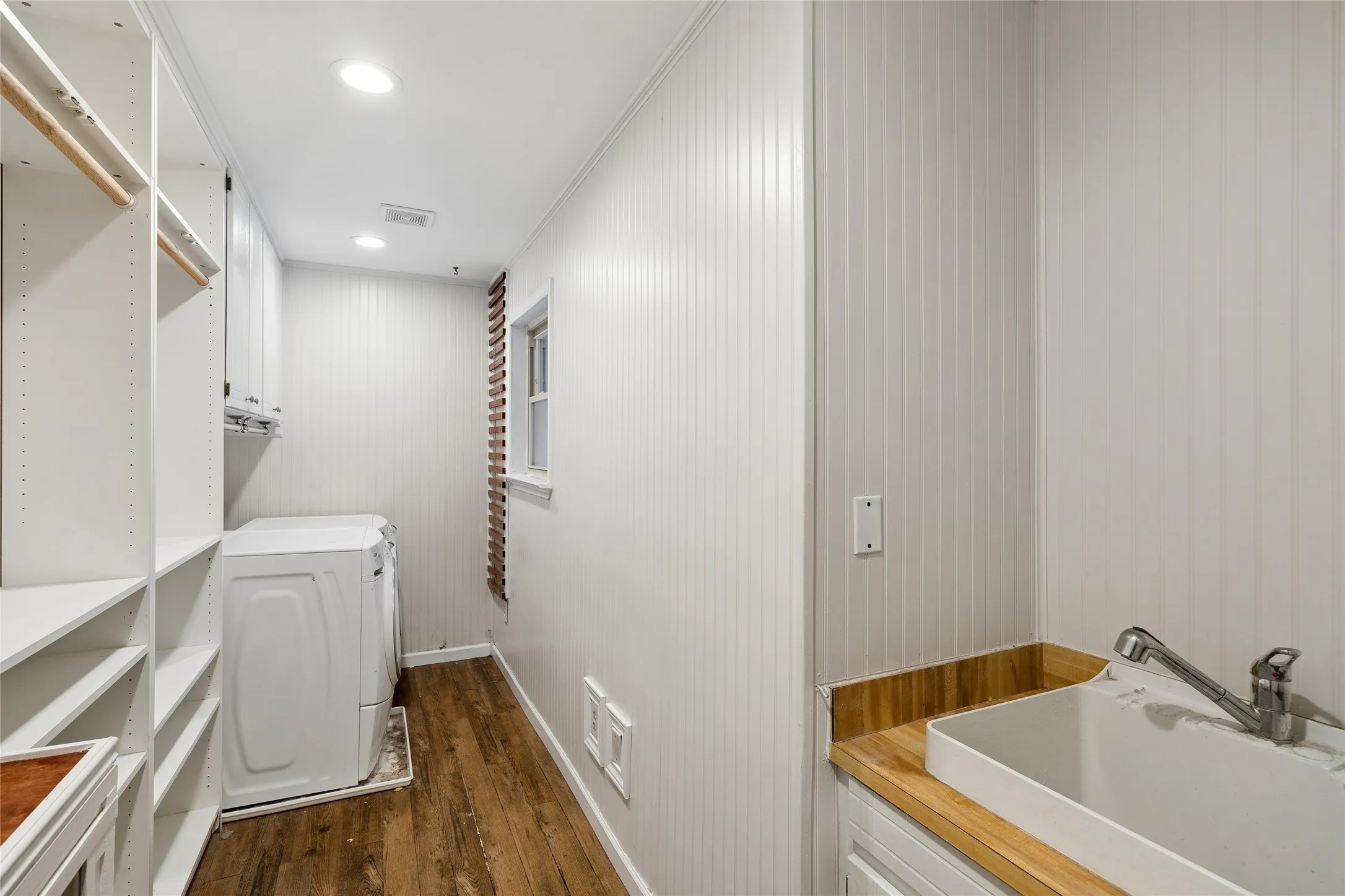 Large laundry area with sink