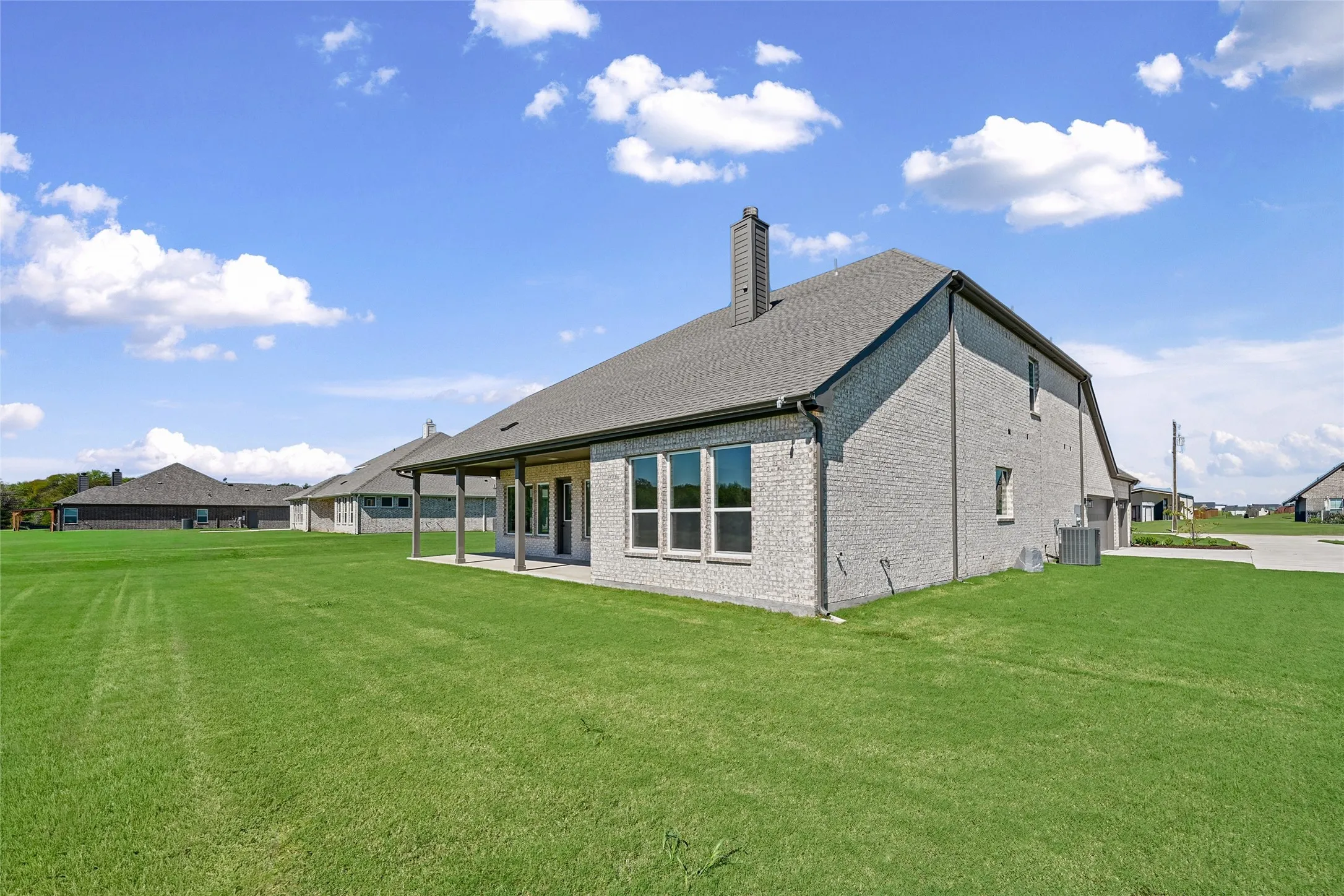 Expansive green lawn providing ample outdoor space