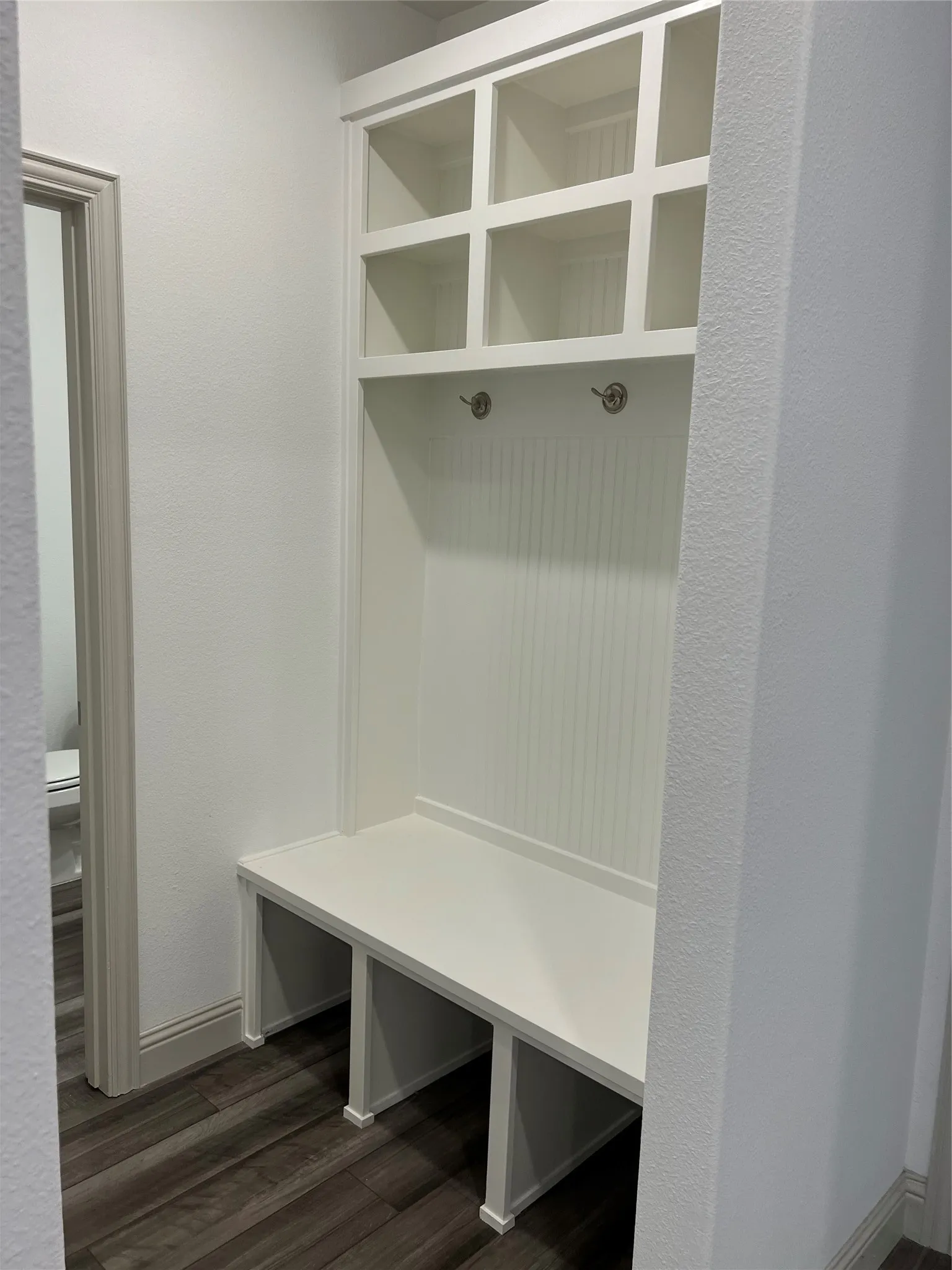 Mudroom with dark wood-type flooring
