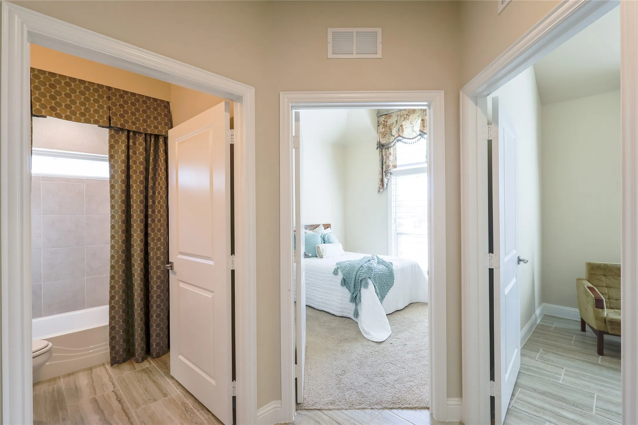 Hallway featuring wood-finish tile flooring and neutral wall tones