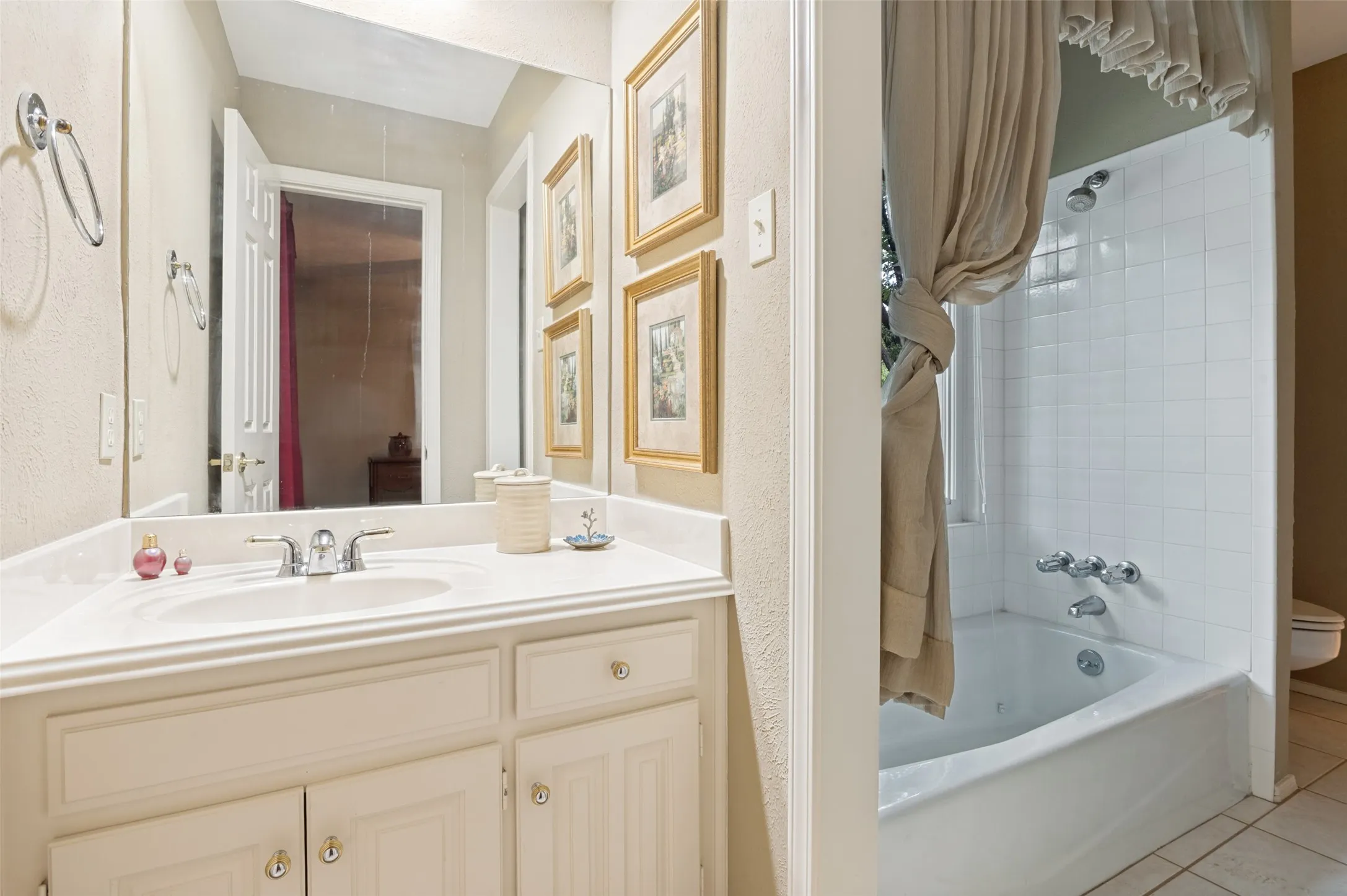 Bathroom vanity with an integrated sink and chrome faucet