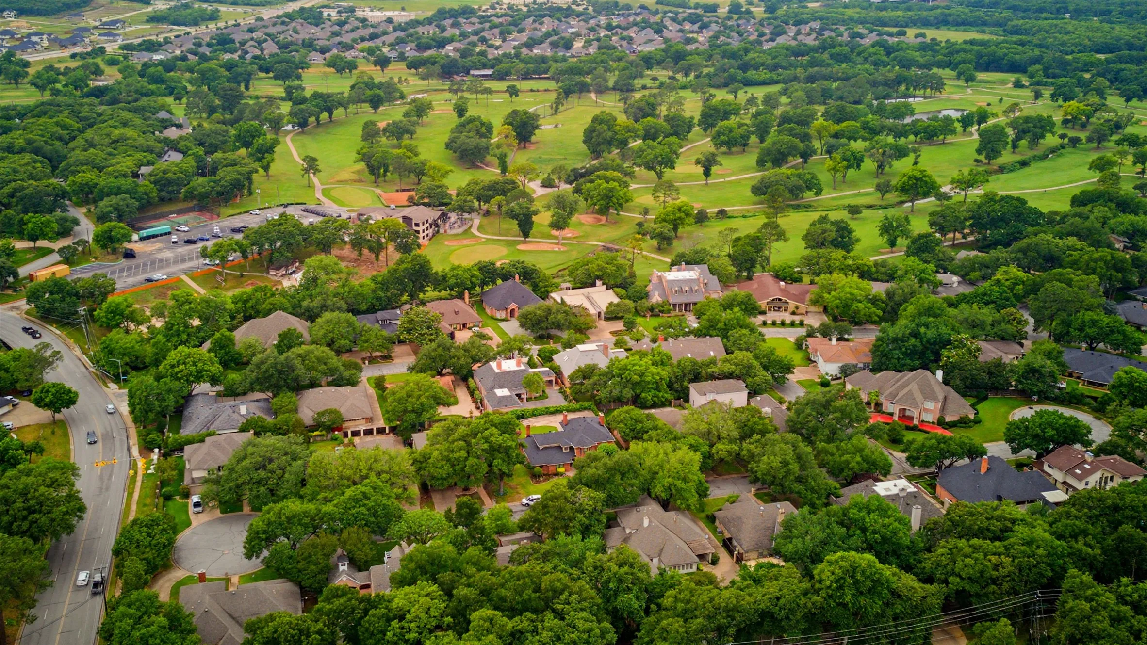 Expansive residential area featuring a variety of single-family homes with mature trees and landscaping