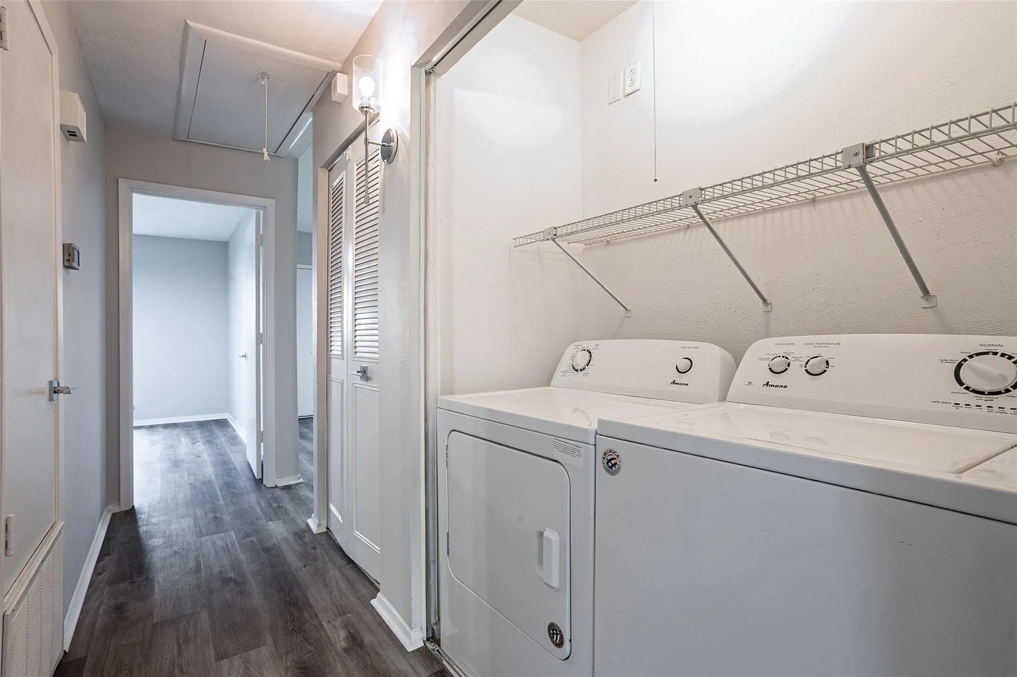 Dedicated laundry area featuring white washer and dryer units