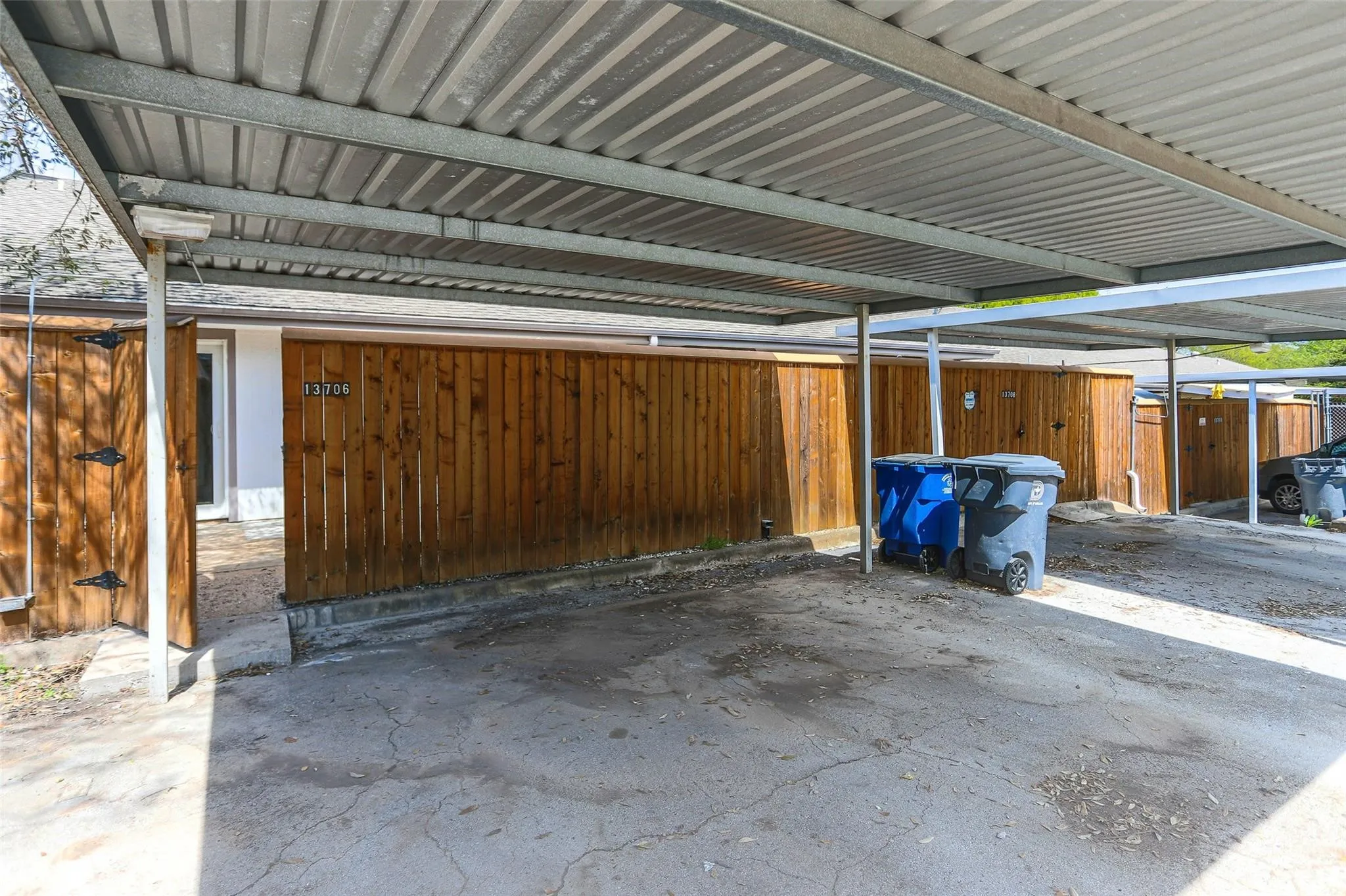 Carport parking with a corrugated metal roof structure