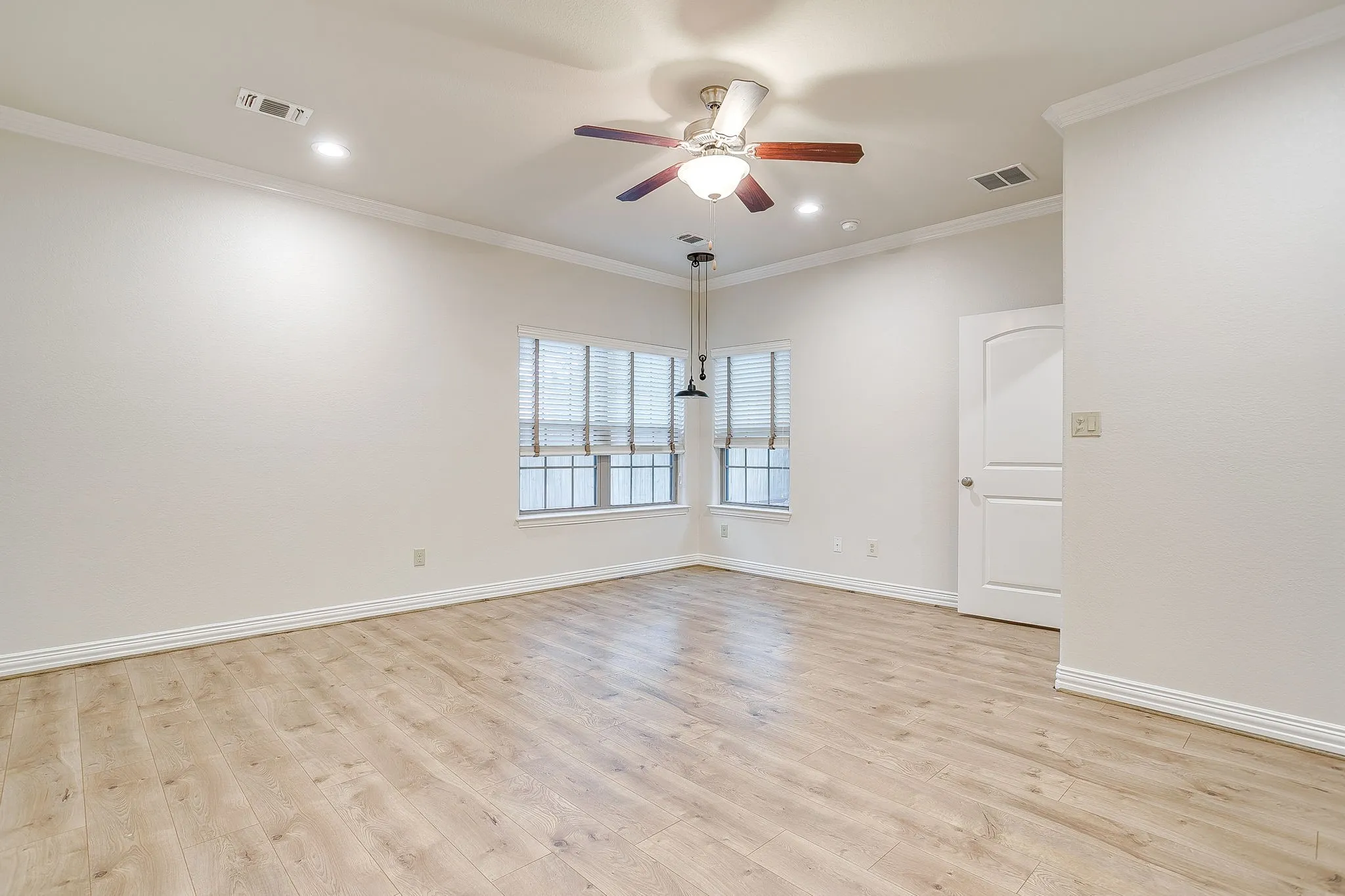 Over sized large master bedroom. Remote shades and ceiling fan. Views in to back yard.