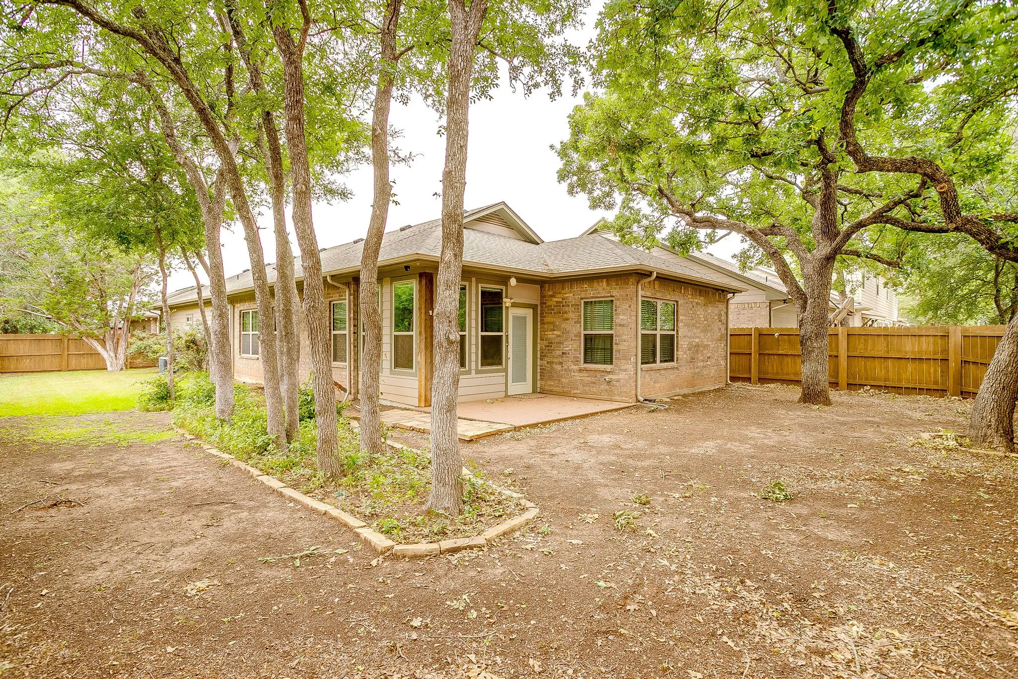 The yard is large on both sides so there is plenty room for the pets to roam. Mature trees everywhere.