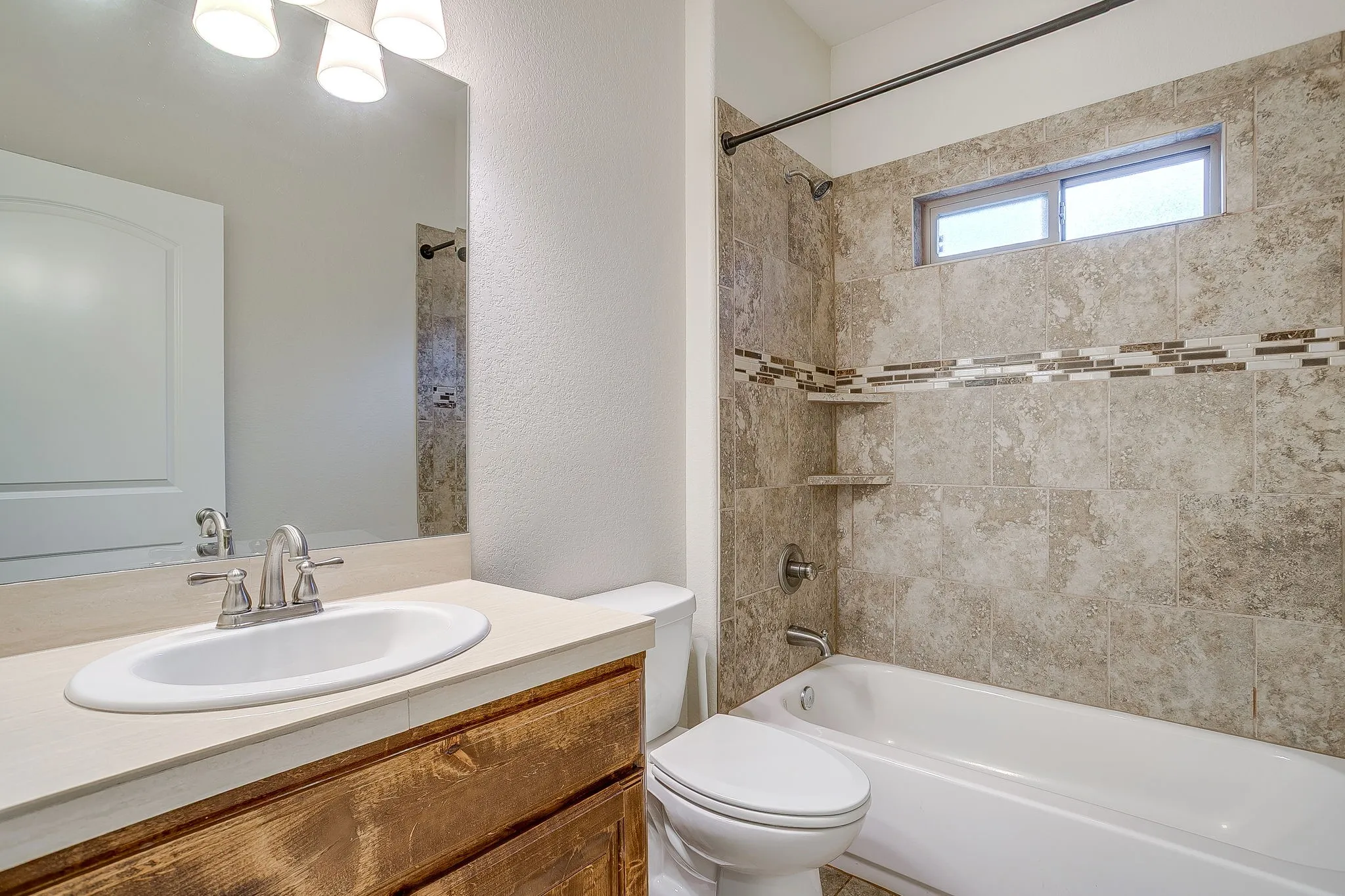 Second or guest bath. Tile counter, tile floors with bath /shower combo