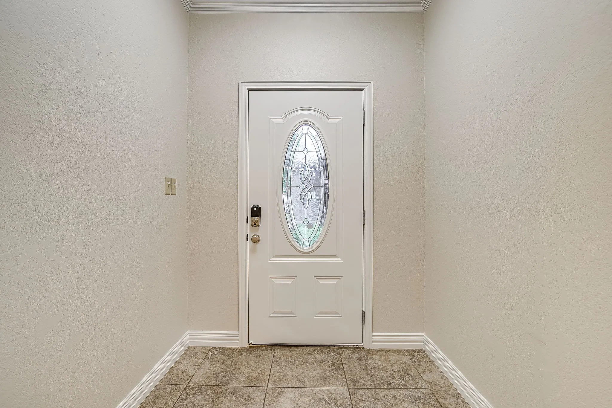 Large open entry to foyer with tile floor