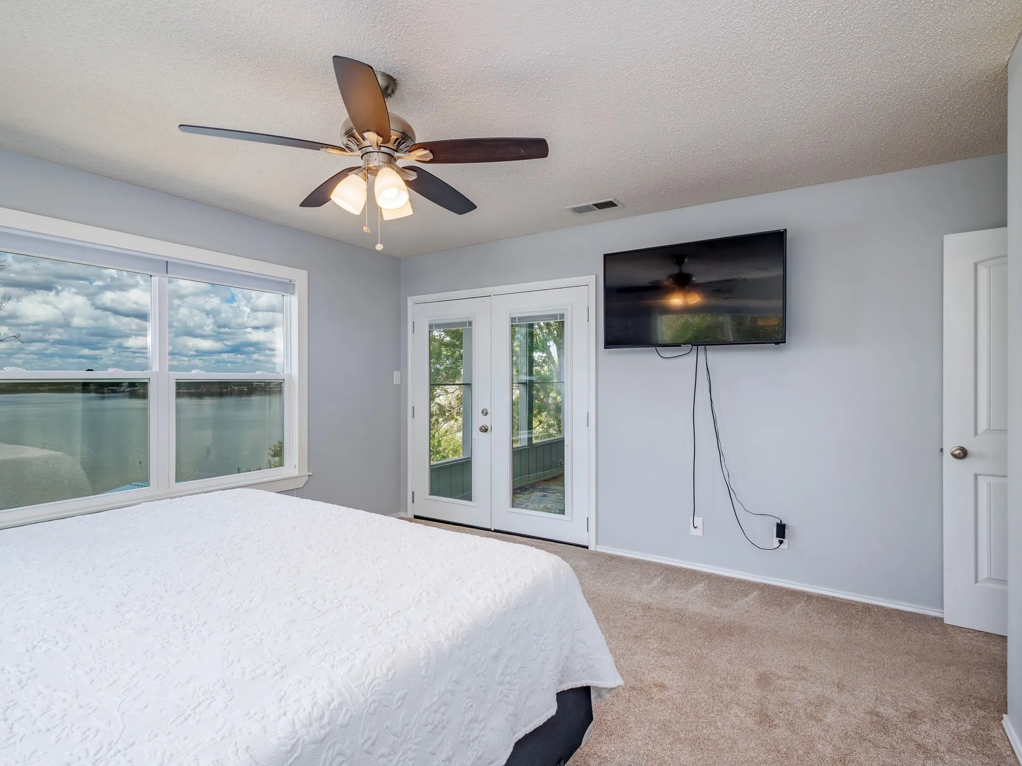 Main bedroom with door out to the screened porch.