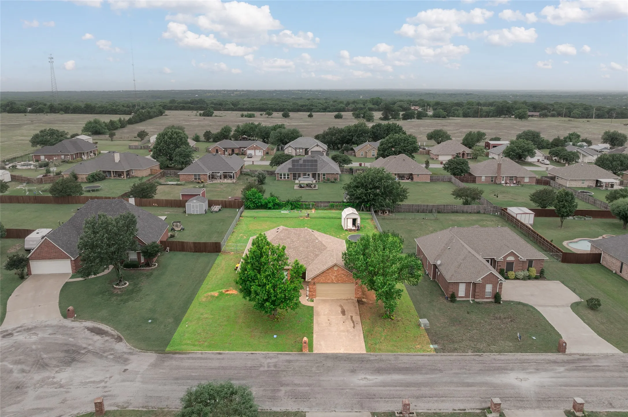 Residential property with a brick exterior and an attached garage