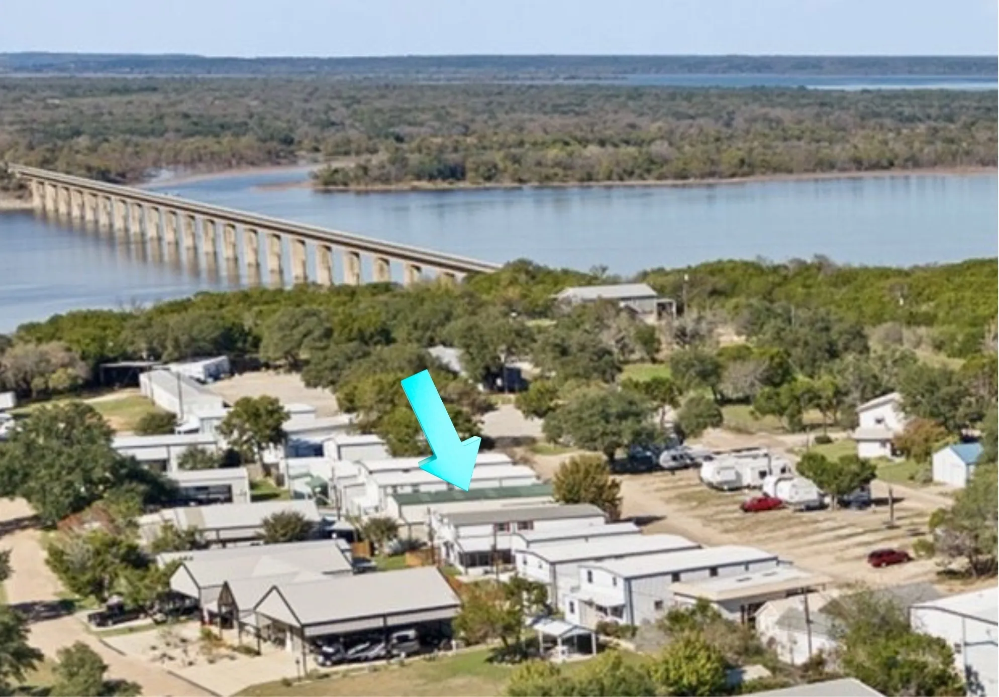 Aerial perspective highlighting a body of water and a multi-span bridge structure