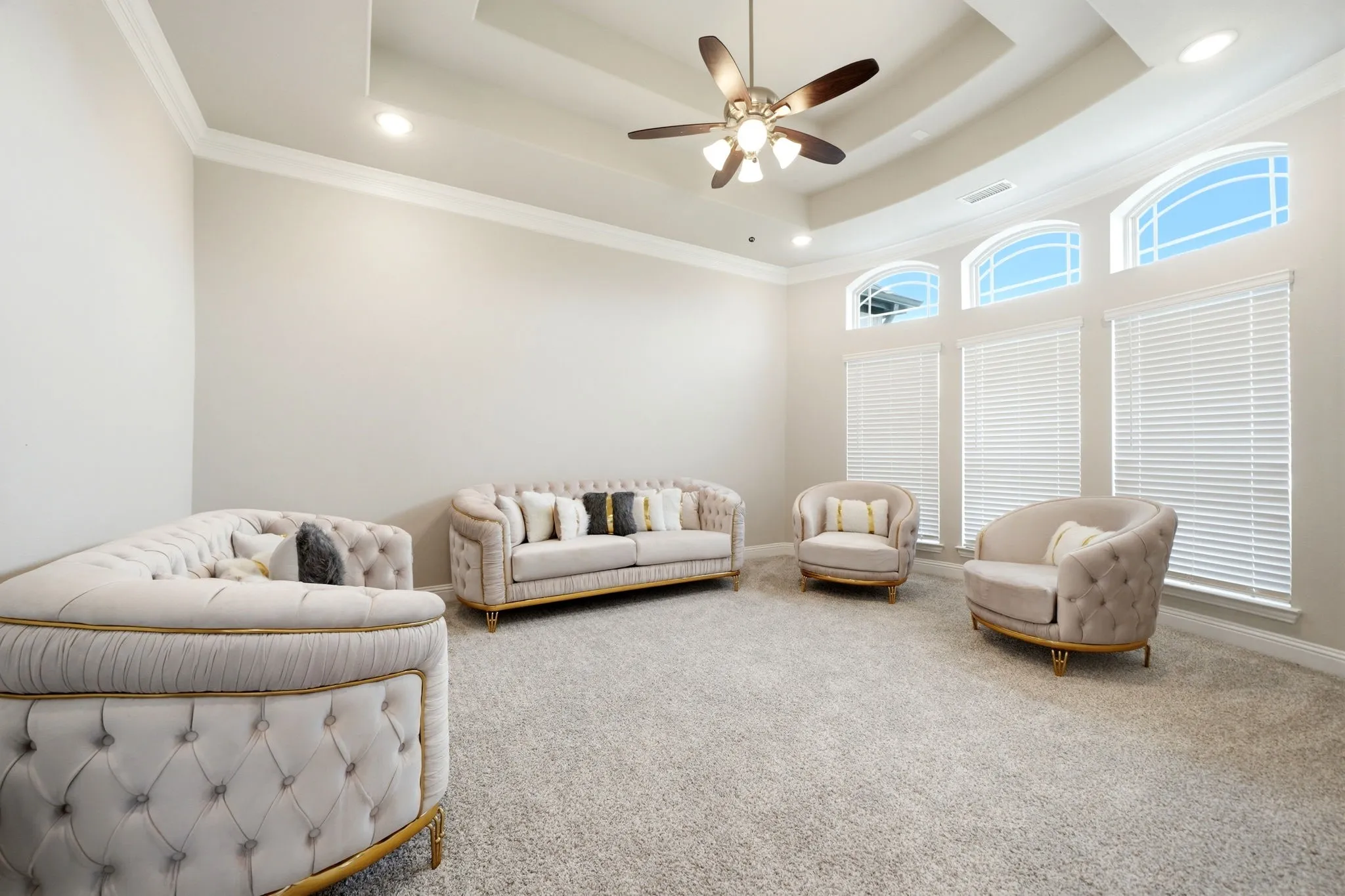 Tray ceiling featuring recessed lighting and a ceiling fan