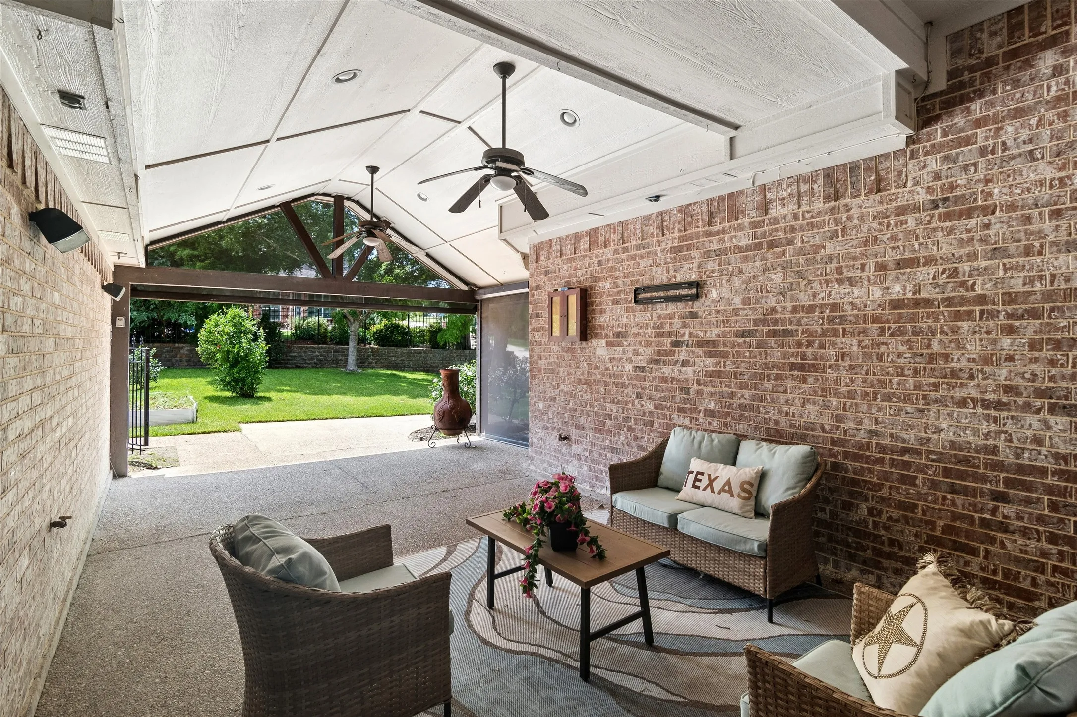 Expansive covered patio with remote screen