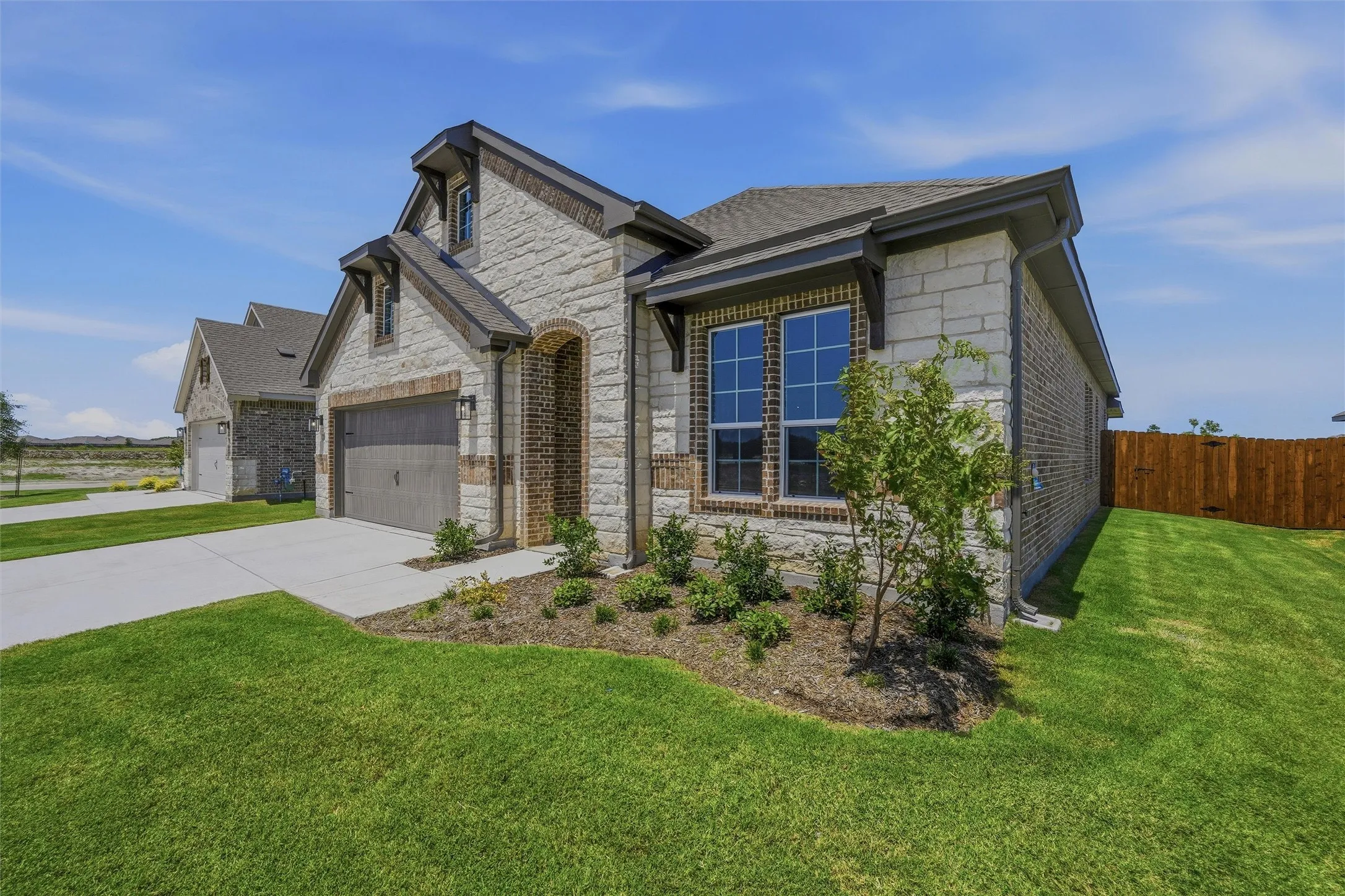 Stone and brick exterior with dark trim accents