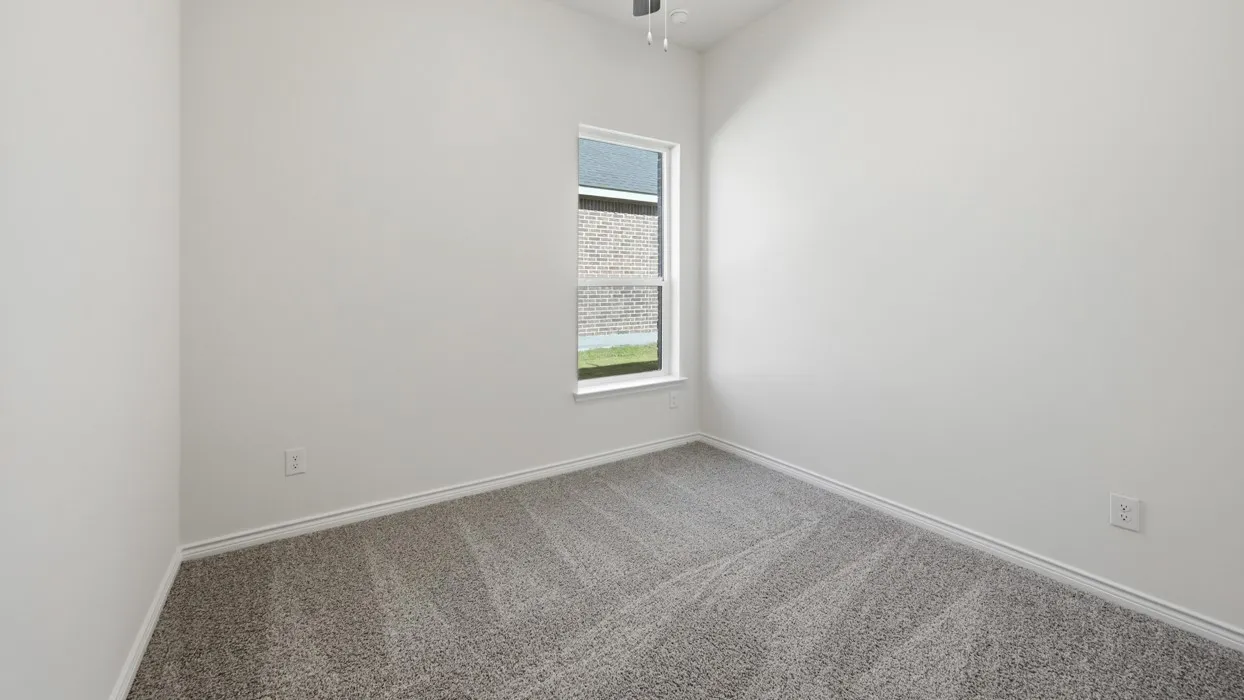 Carpeted room featuring a single window, white walls, and a ceiling fan