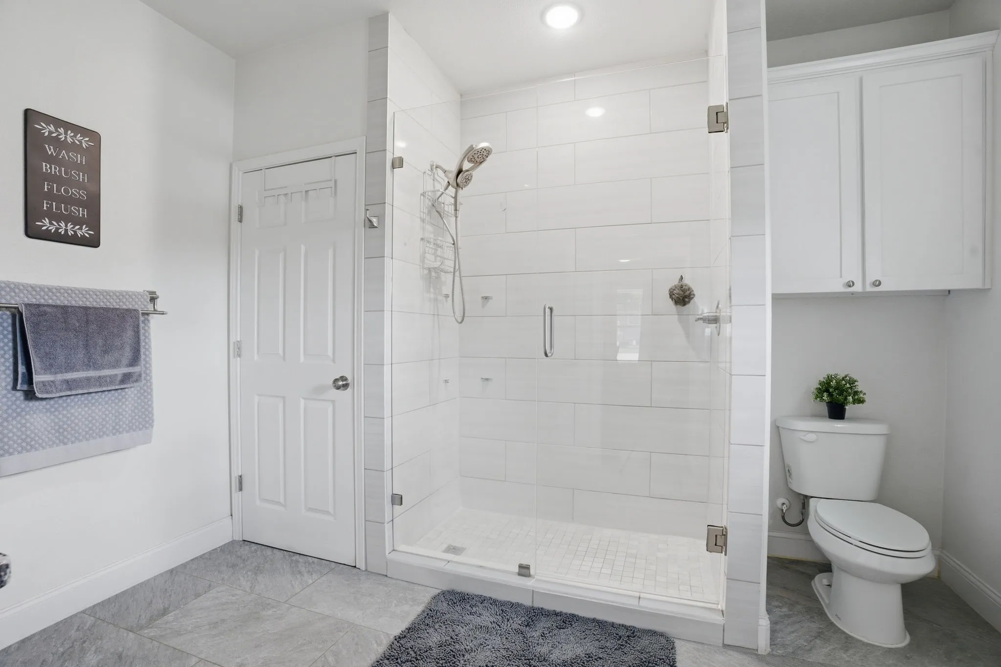 Great storage and an oversized shower with frameless glass