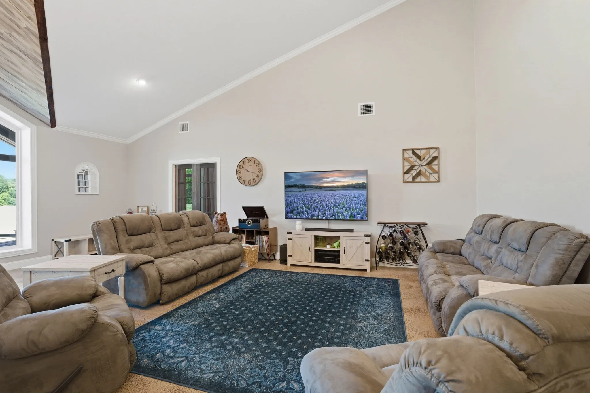 Living Area definitely offers space to stretch out! Stained concrete floors and soaring ceilings make for the perfect place to relax!