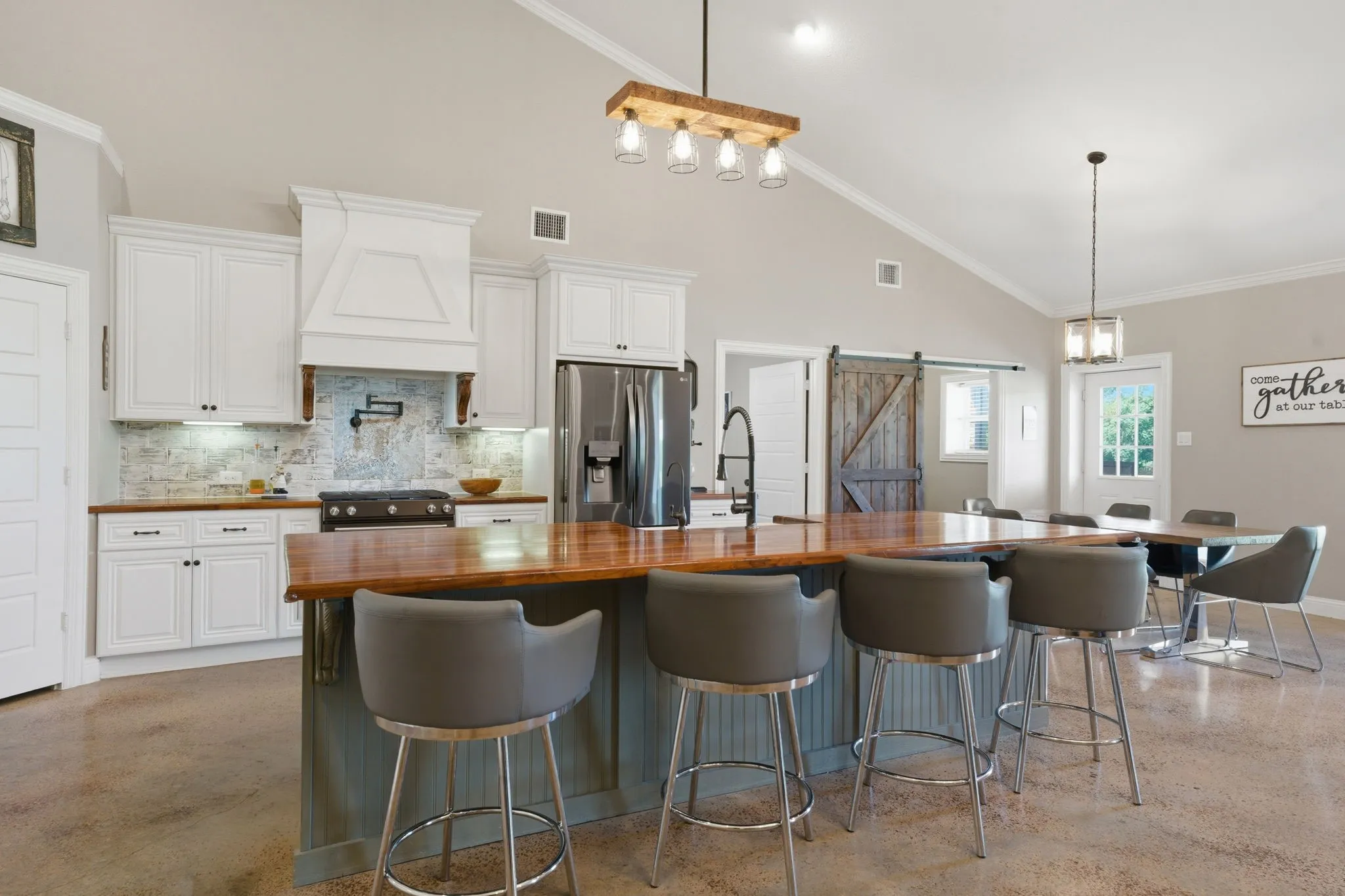 Bar seating and gorgeous butcher block counters. There is a large walk-in pantry in the corner.