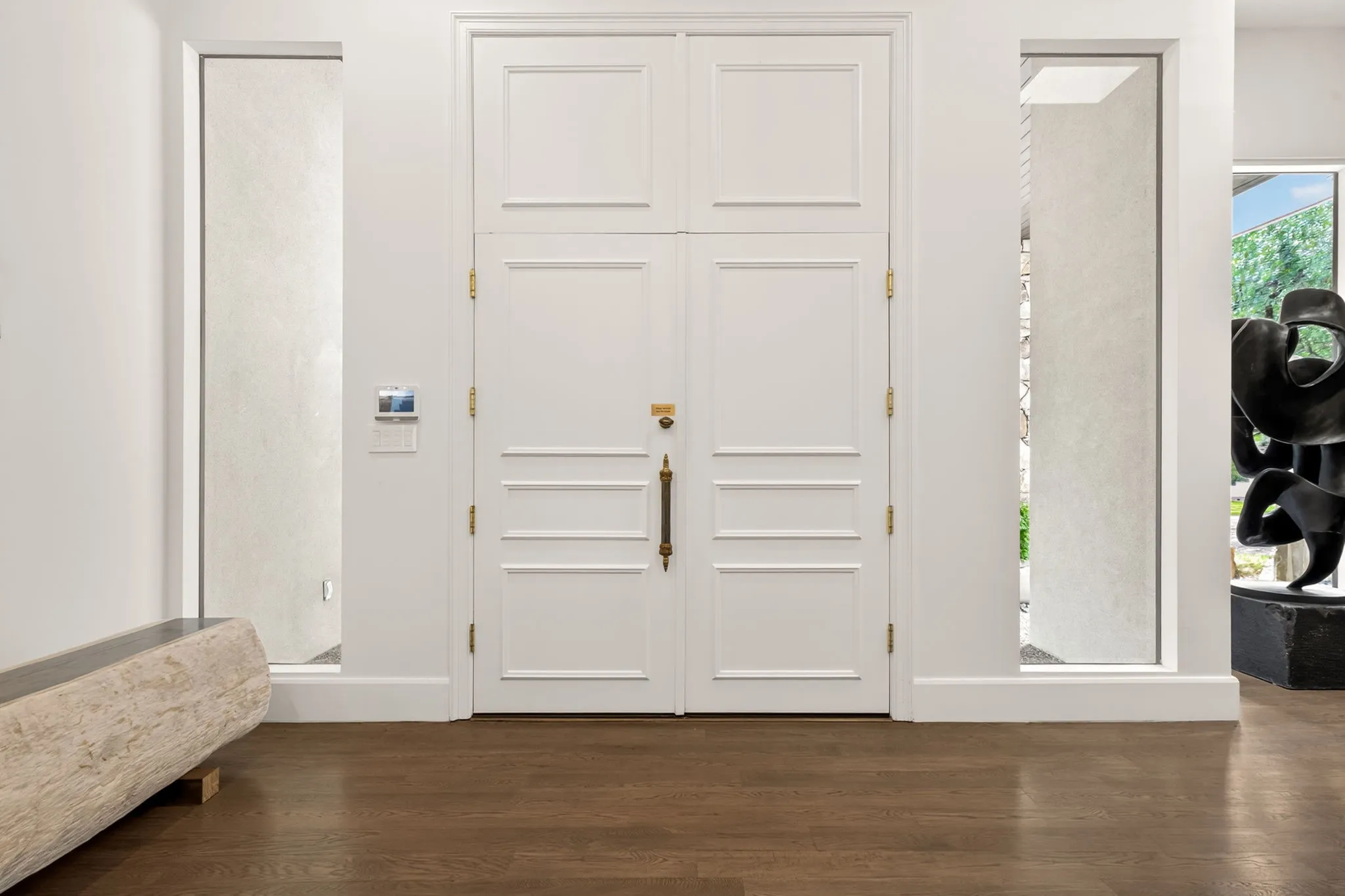 Grand double entry doors with paneled detailing