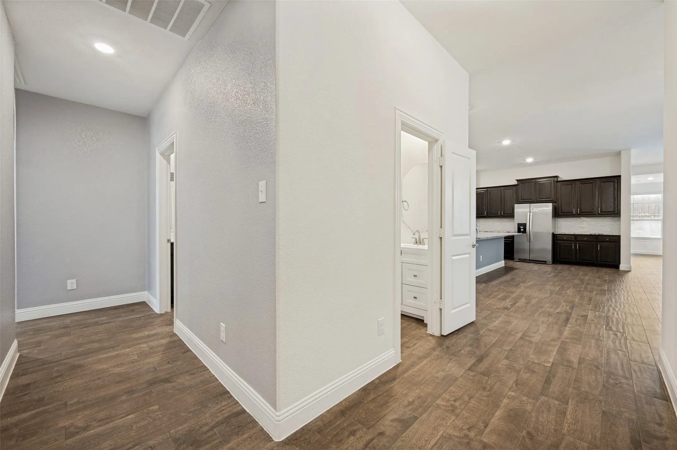 Hallway leading to three bedrooms & full bathroom
