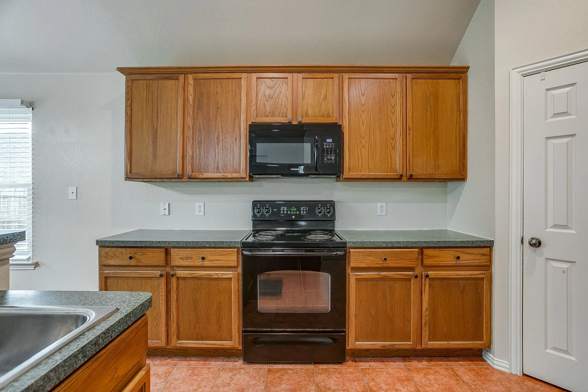 Spacious Kitchen with ample storage and counter space