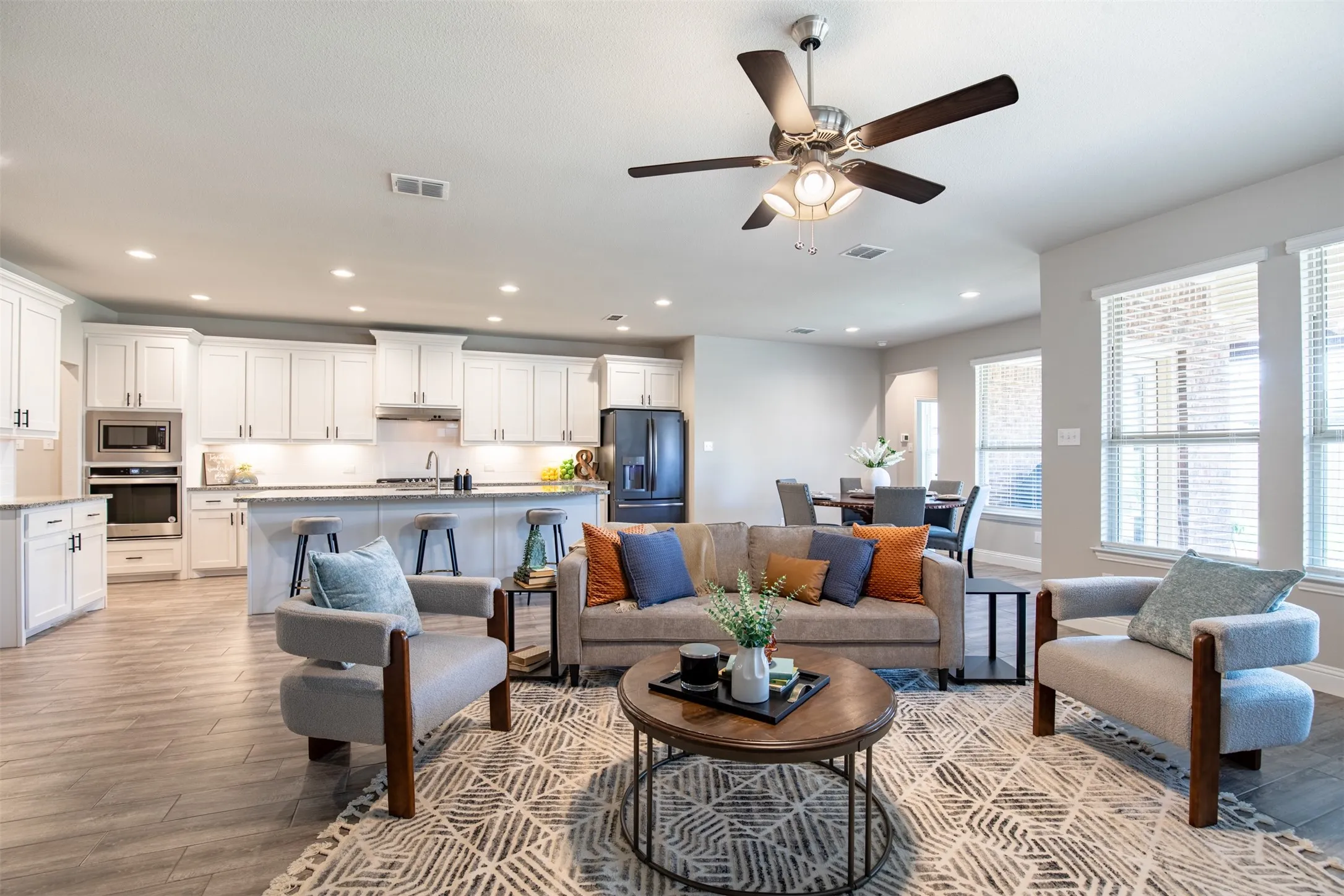 Family room is open to the kitchen and dining, with direct access to the oversized outdoor patio.