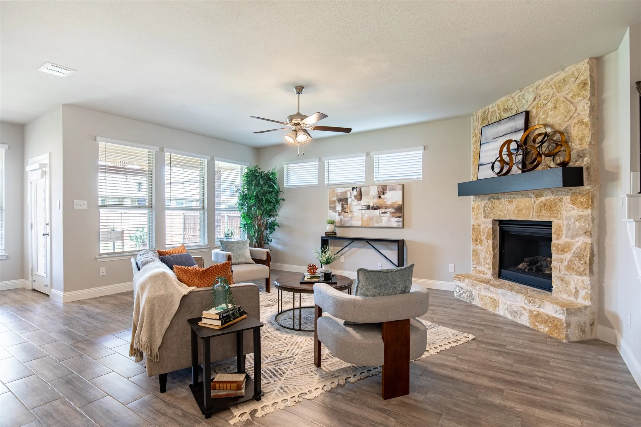Upgraded with a beautiful stone fireplace and mantle.