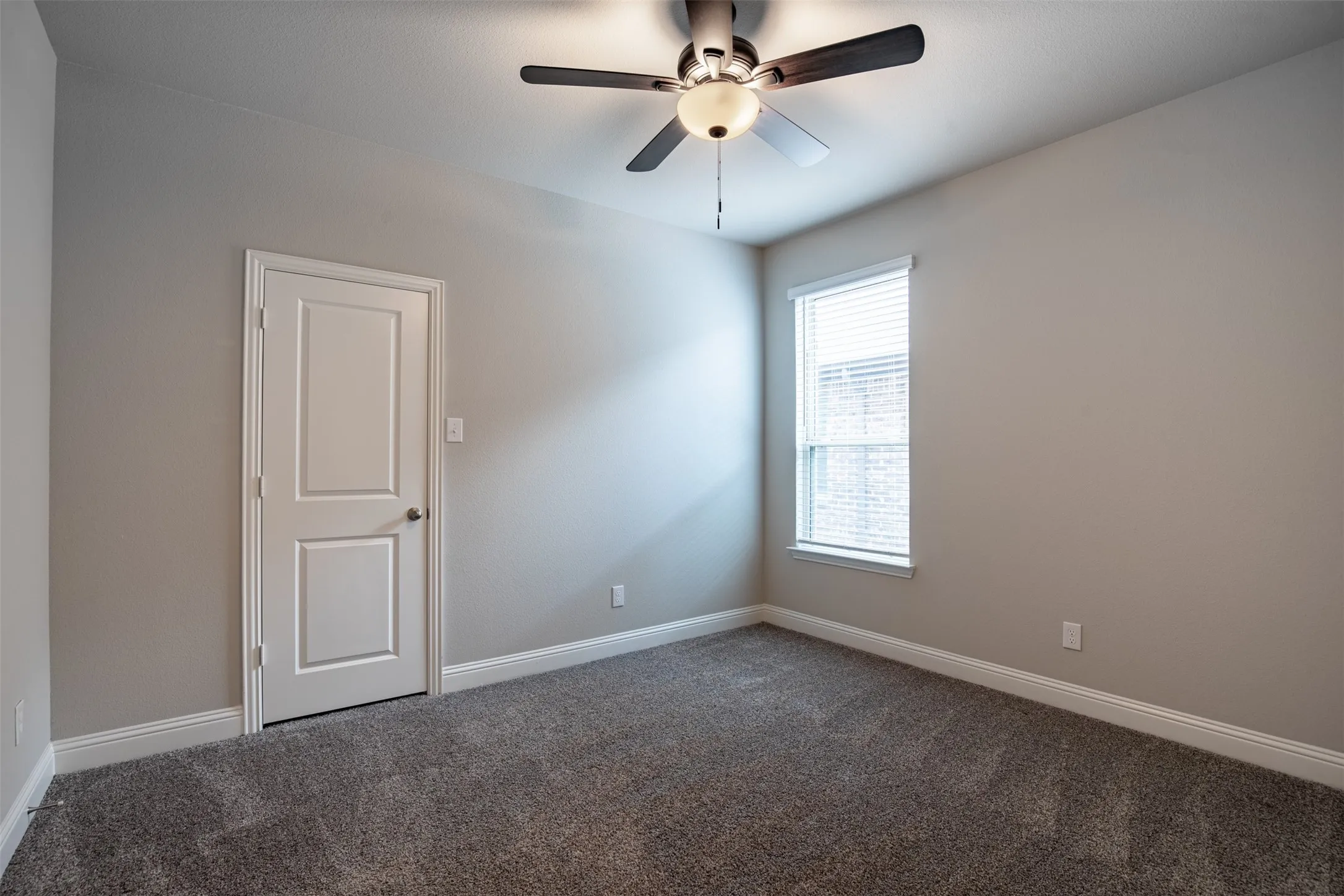 Main level guest bedroom next to a full bath.