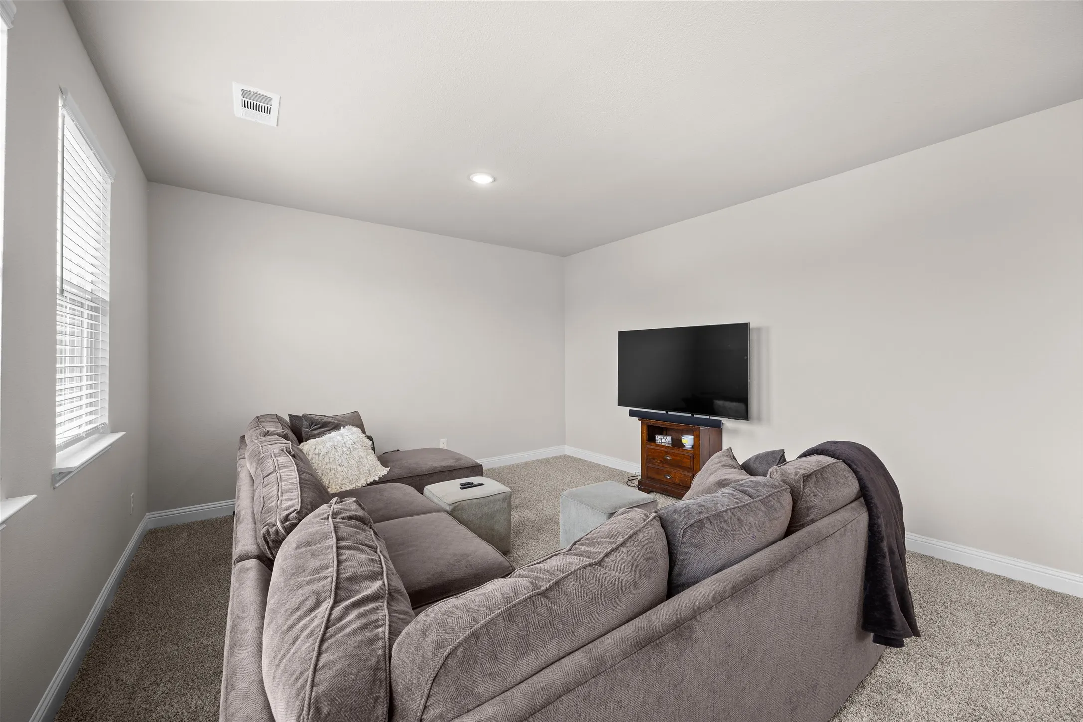 This spacious game room is the ultimate flex space, perfectly tucked away over the garage and just off the entrance to ensure loud game nights, movie marathons, or kids being kids won't disrupt the rest of the house. With its elevated and isolated positioning, you can enjoy maximum fun with zero noise carrying downstairs—making it a true entertainer's retreat or peaceful sanctuary.