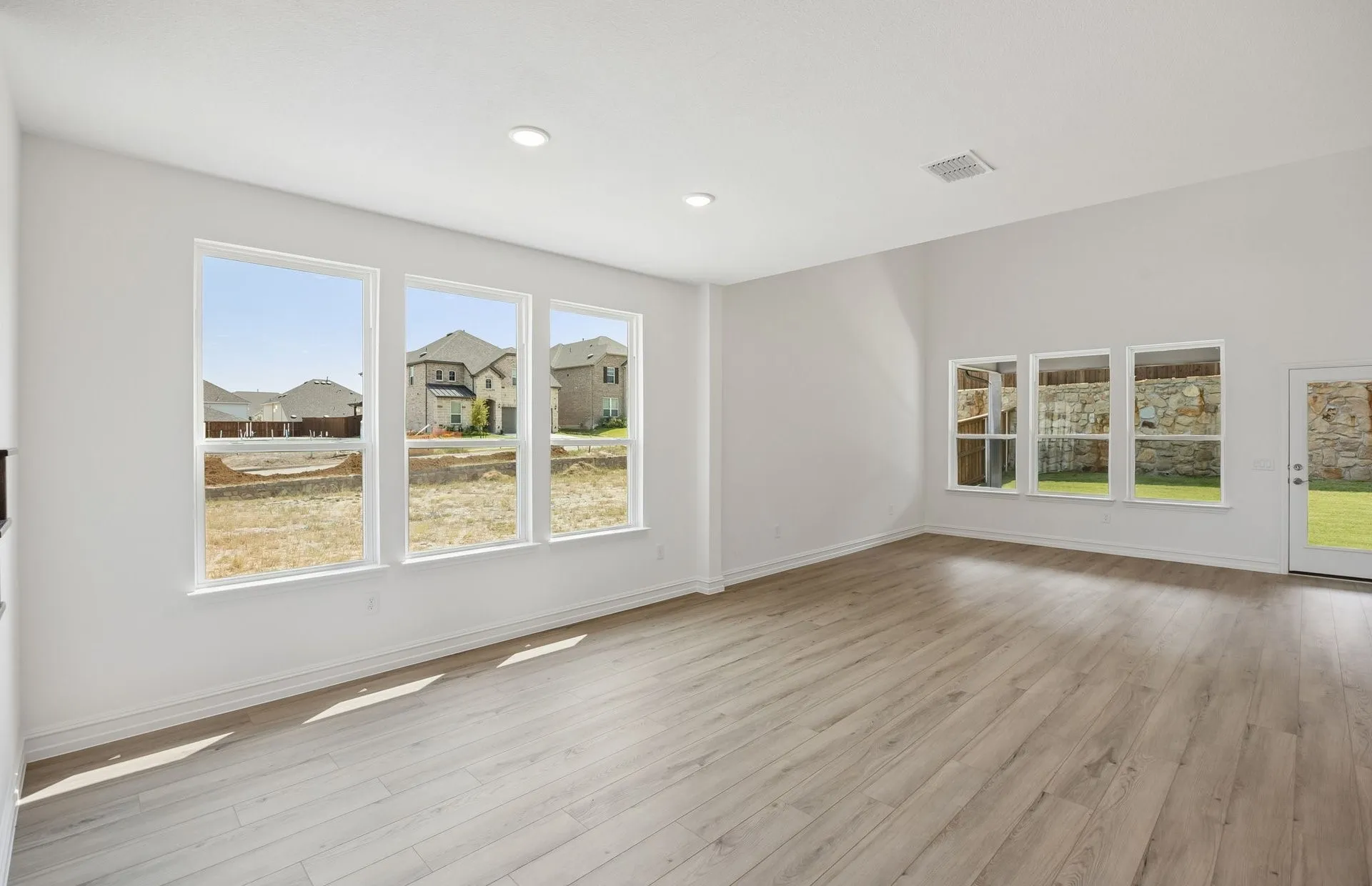 Large windows and natural light in gathering room