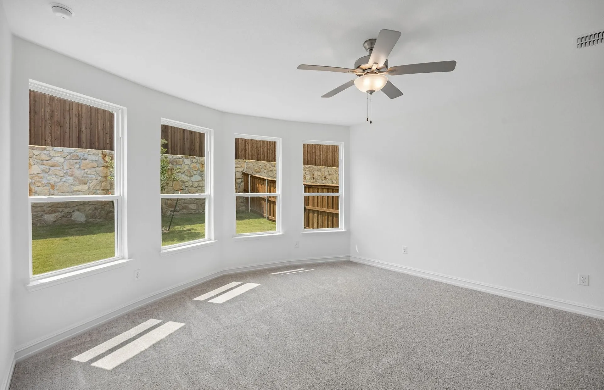 Primary bedroom with bay windows