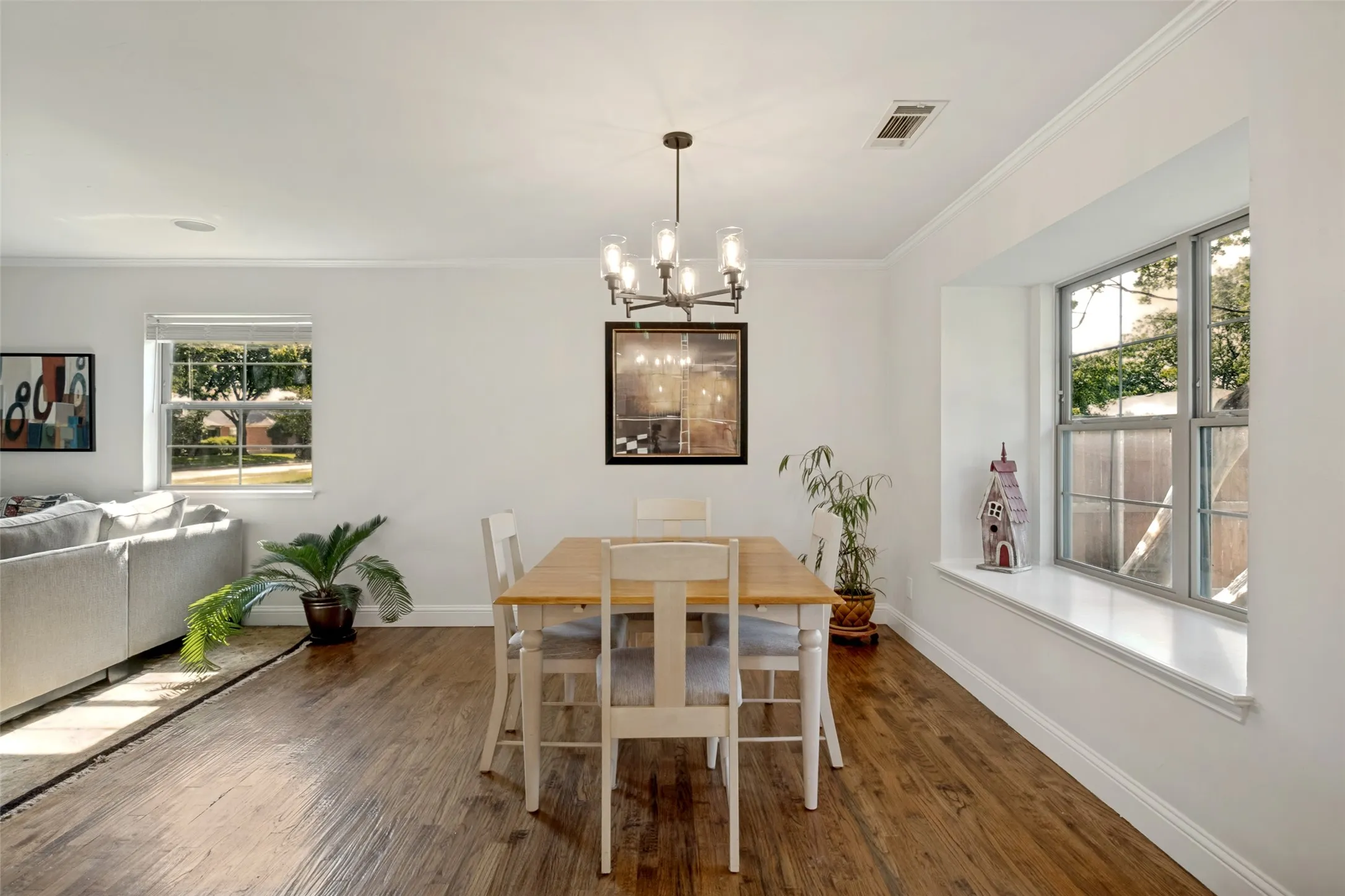 Dining area featuring new lighting and a window seat