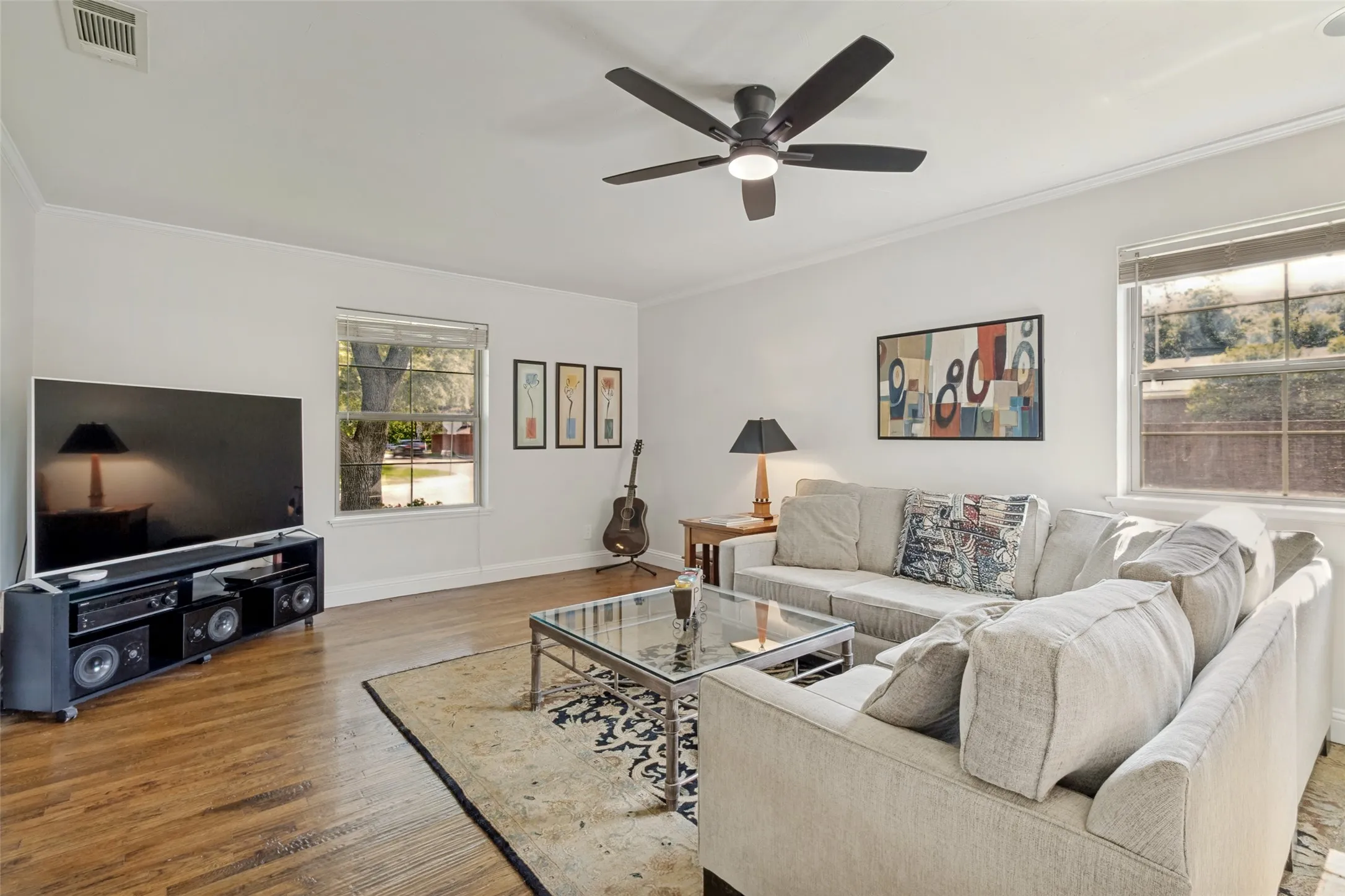 Spacious living area featuring wood flooring