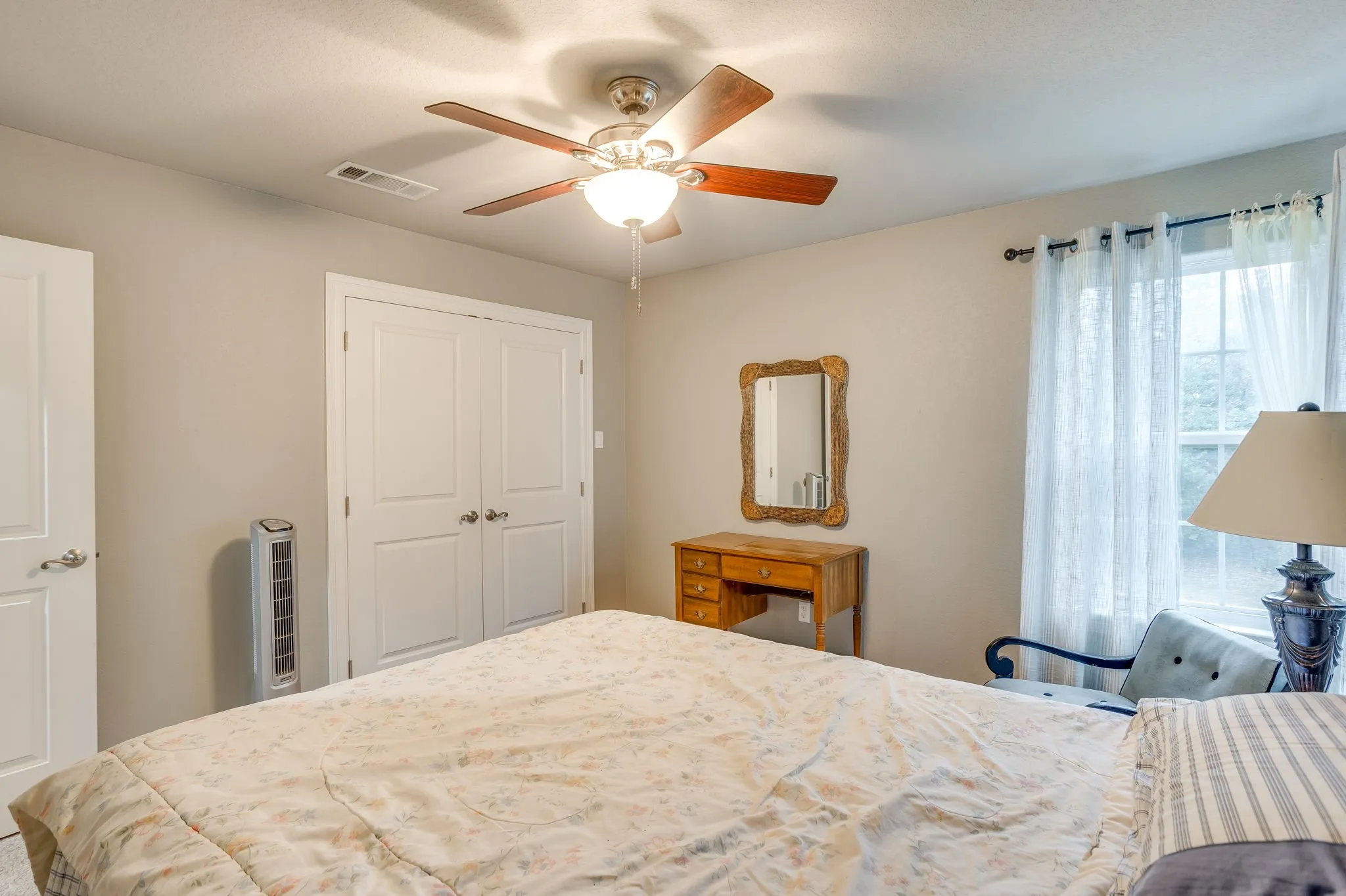 Recessed window with sheer white curtains