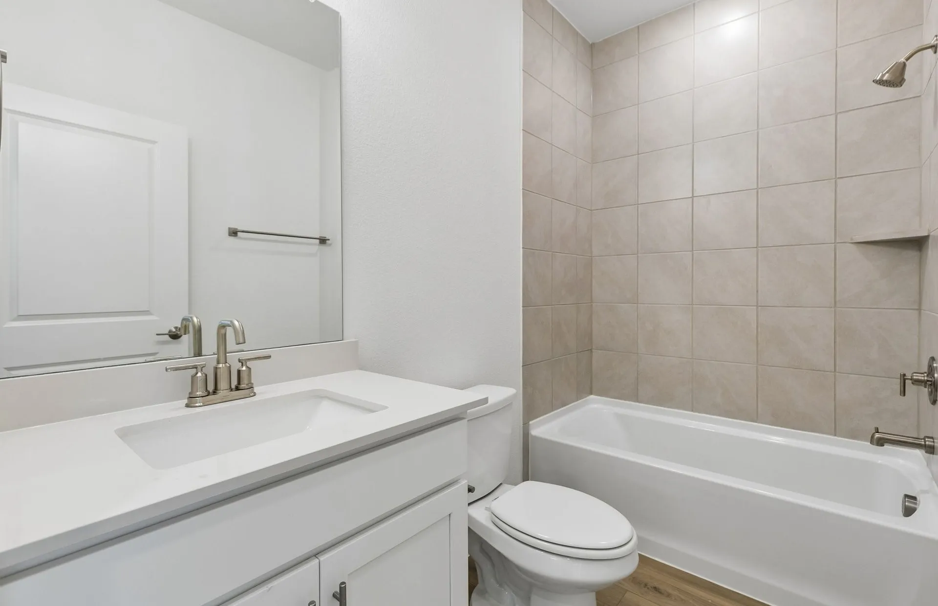 Secondary bath with tile surrounded shower