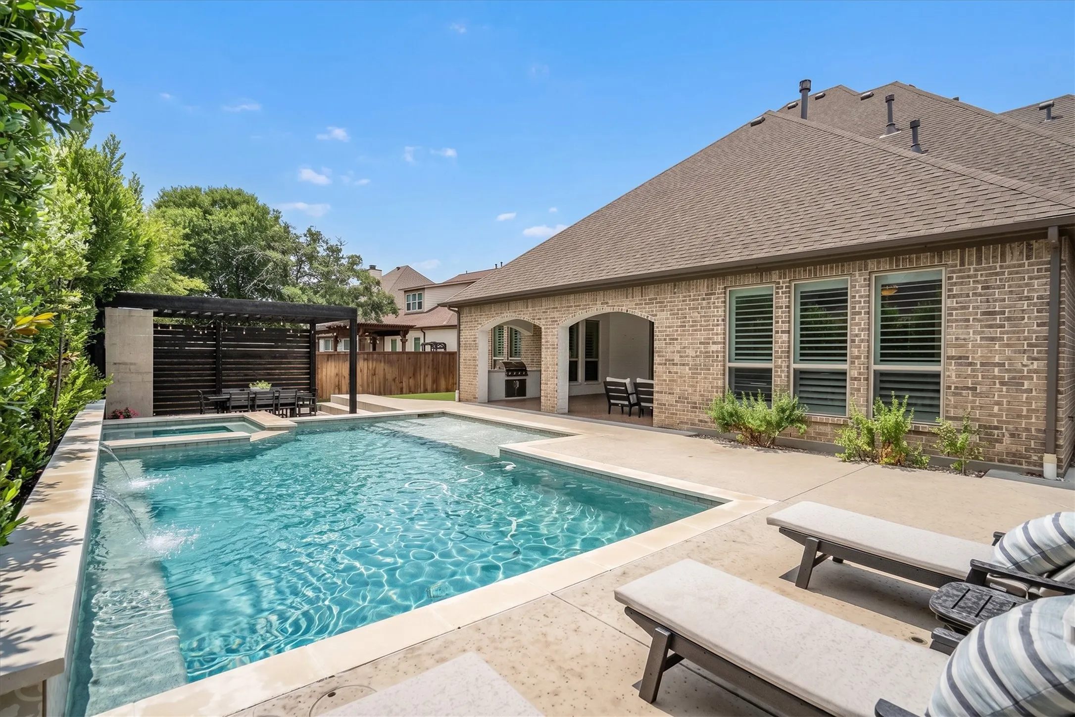 Exceptional outdoor space with living, dining, and pool lounge space!