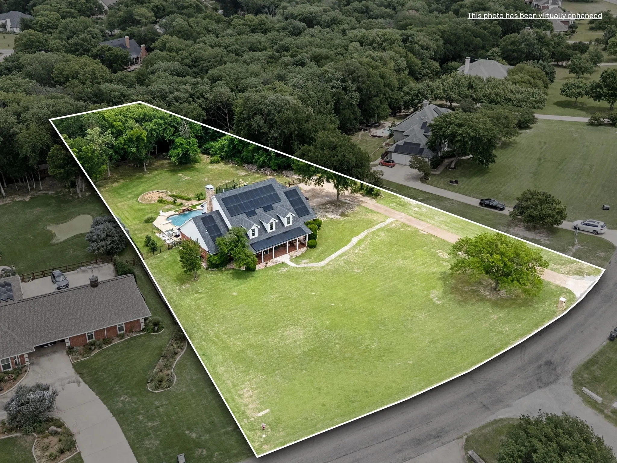 1.5 acre wedge shaped lot with subtle slope to the back