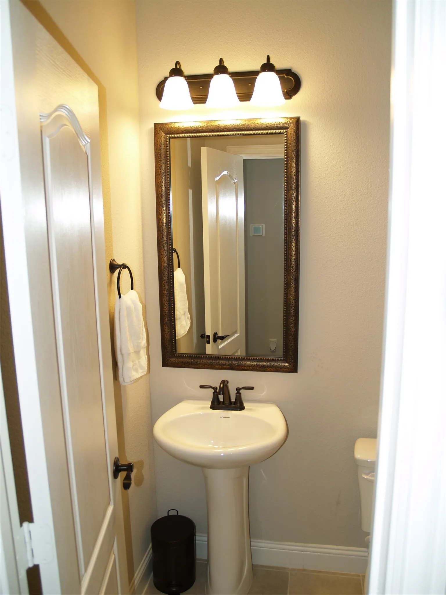 Powder Bath located conveniently by the downstairs living area