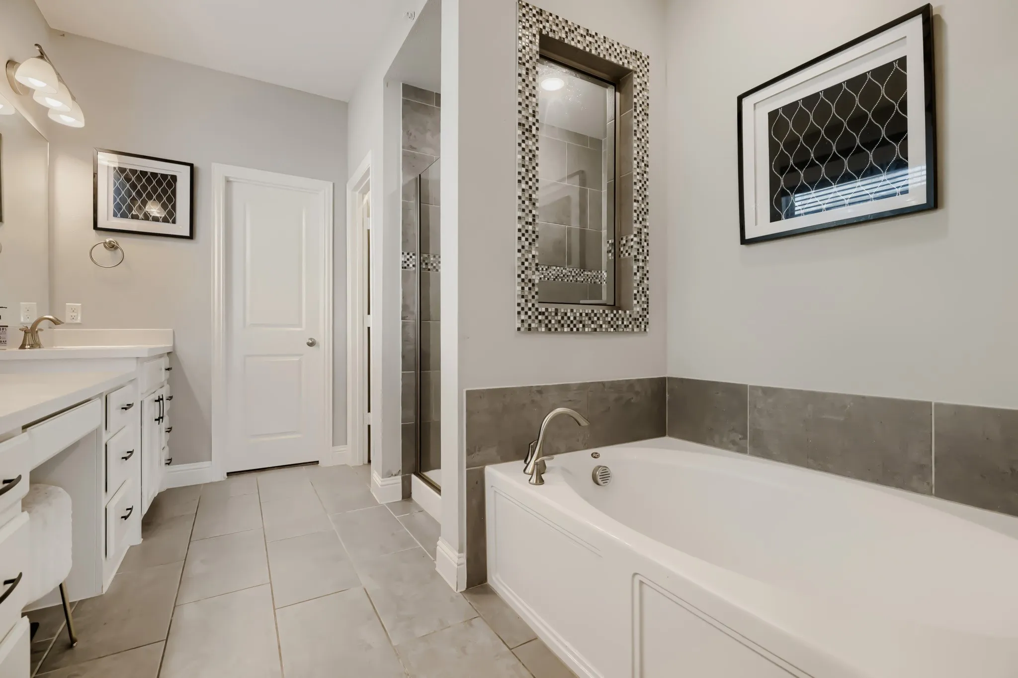 Bathroom with a built-in soaking tub and shower enclosure