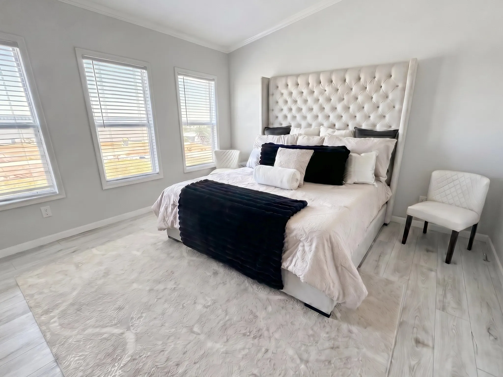 Spacious primary bedroom with a stunning view of the lake.