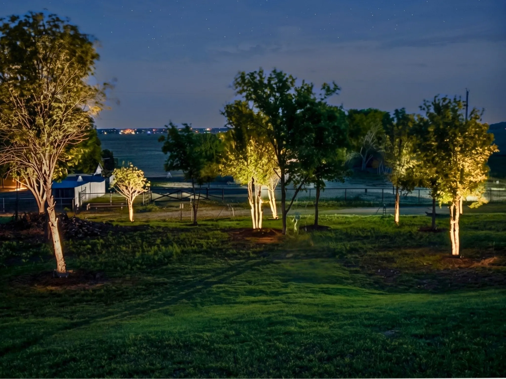 Landscape lighting installed throughout the yard.
