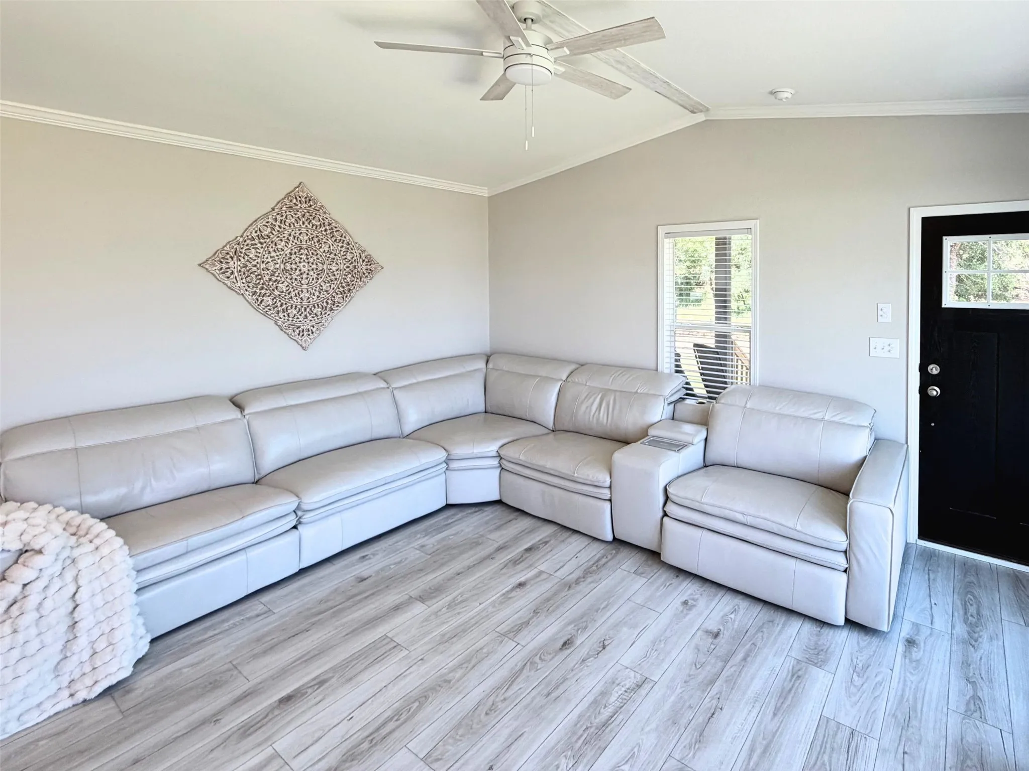 The spacious open living room easily accommodates this large, oversized sectional.