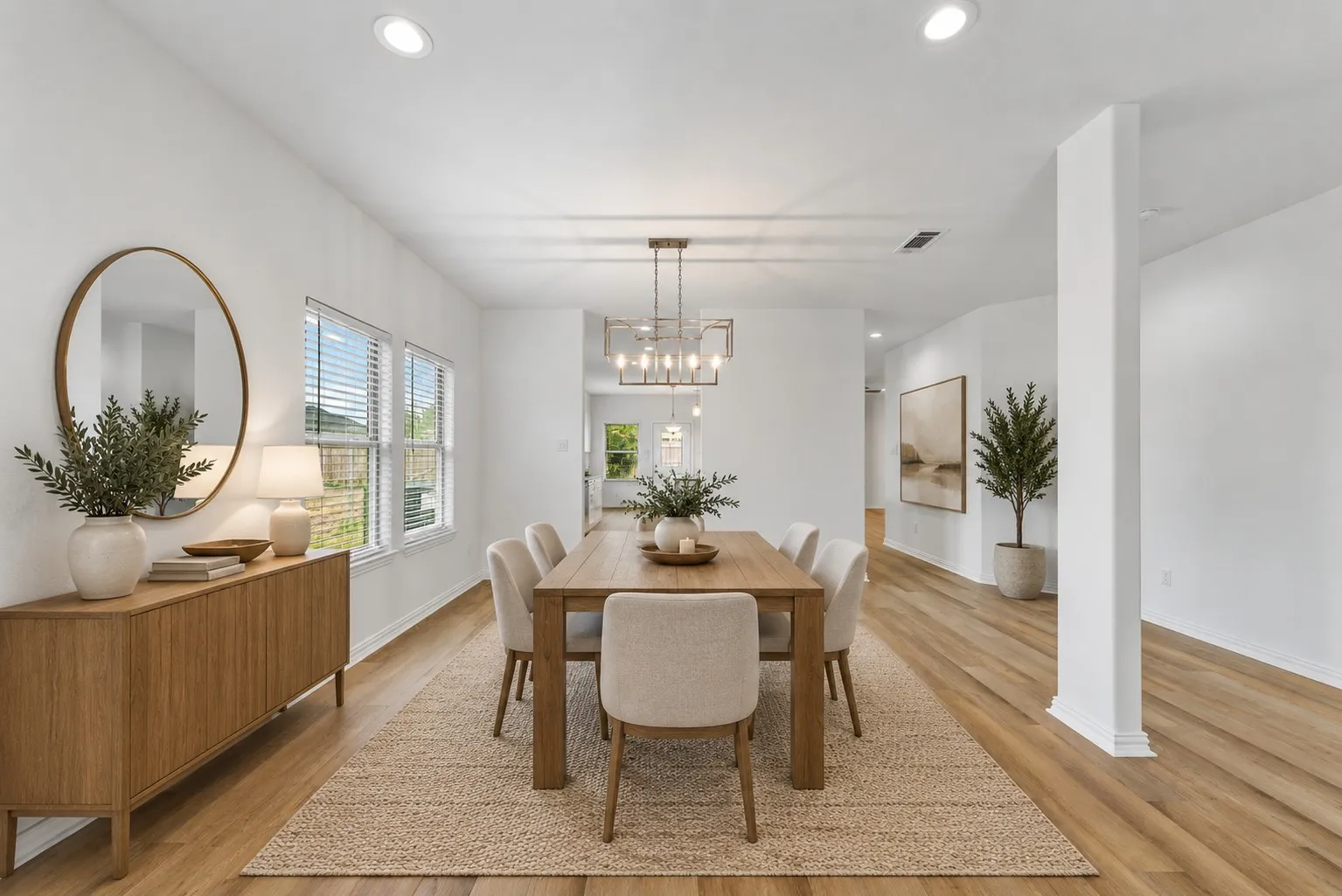 Recessed lighting, wood-finish flooring, multiple windows, and a rectangular chandelier