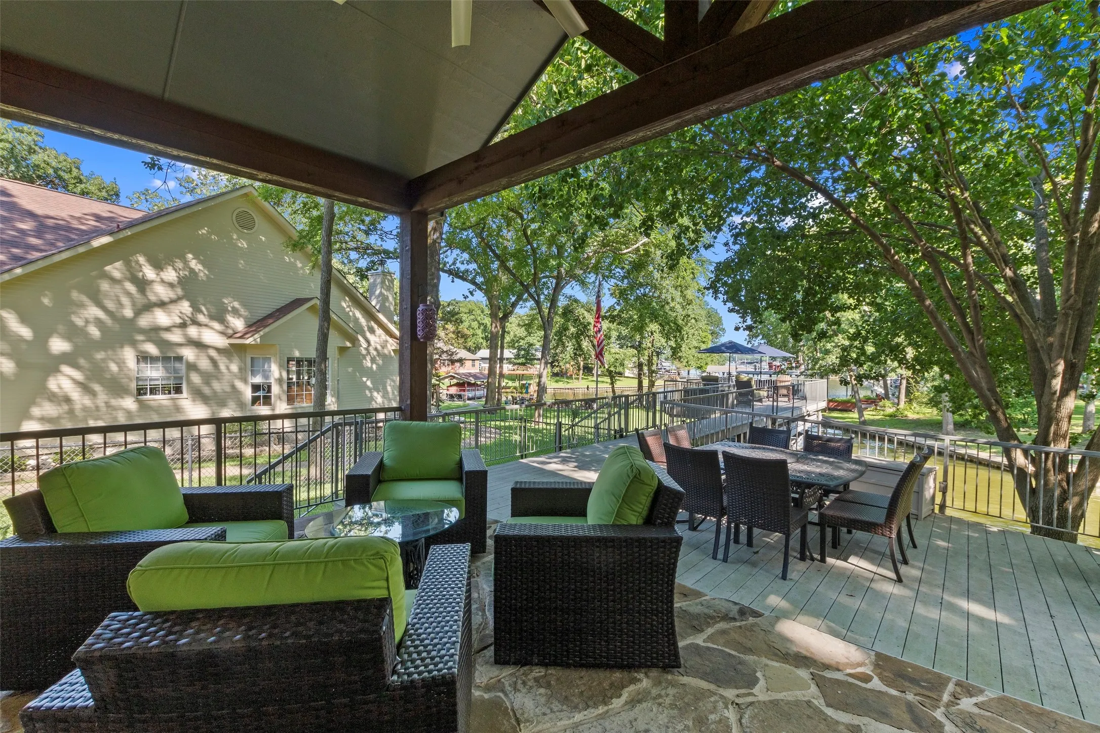Vaulted cedar beams frame an impressive outdoor living area for dining and relaxing.