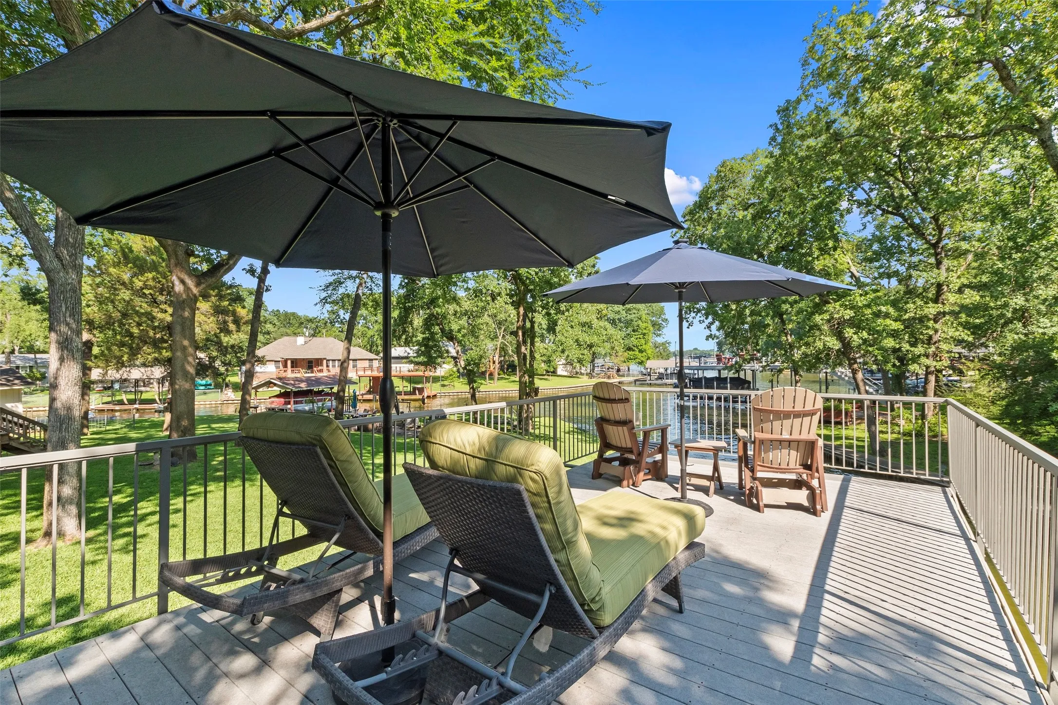 Expansive deck extends over the boathouse with low-maintenance composite decking.