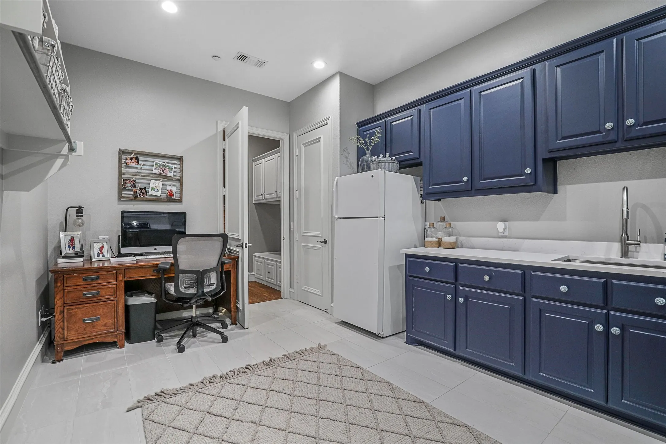 Oversized laundry with custom paint and tons of storage!