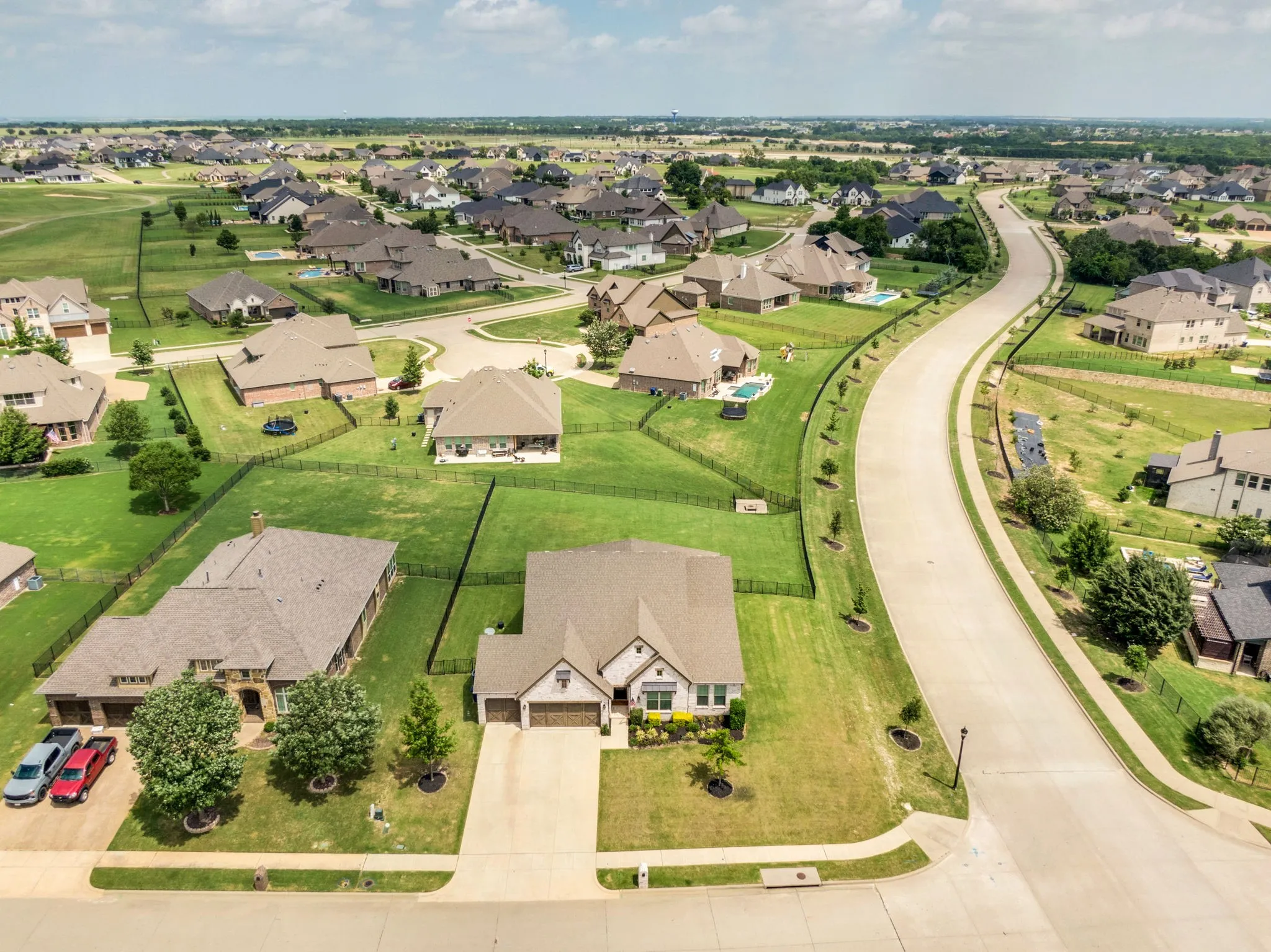 Expansive residential community featuring a variety of single-story and multi-story homes, many with private fenced backyards