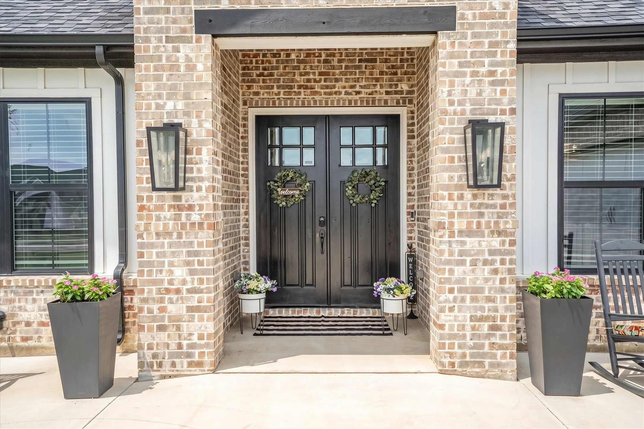 Beyond the front entry, you will find soaring ceilings and hand scraped hardwood floors among other luxury amenities.